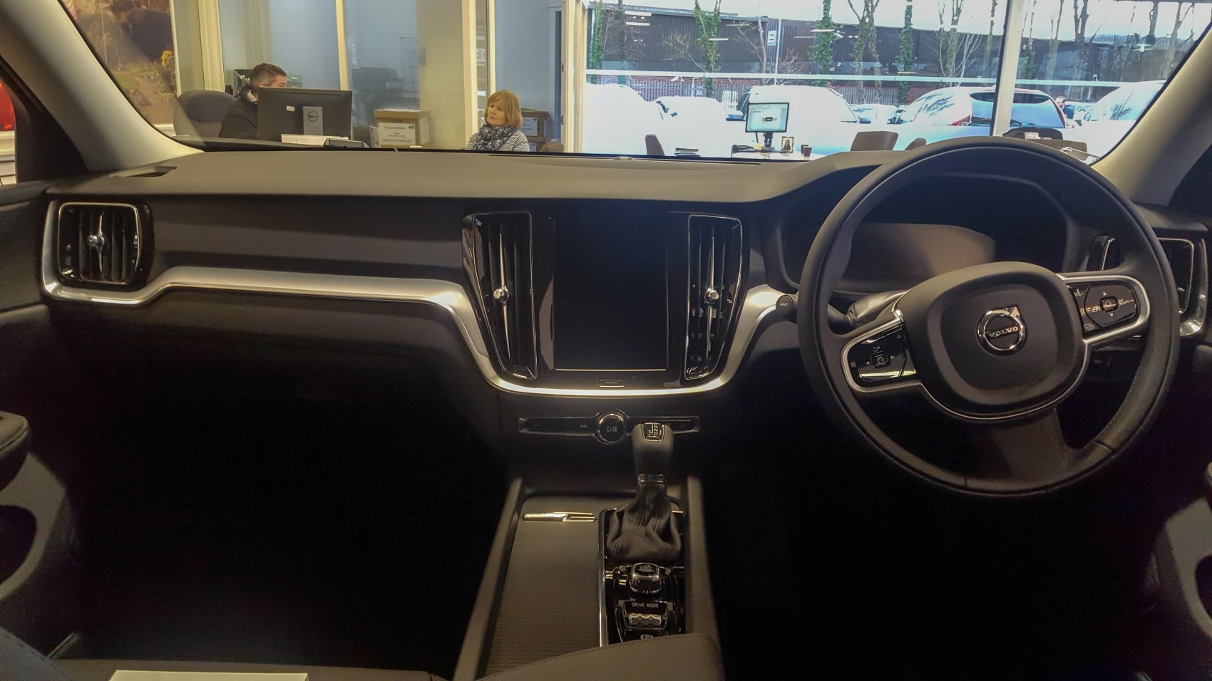 Dashboard and steering wheel with modern controls and touchscreen.