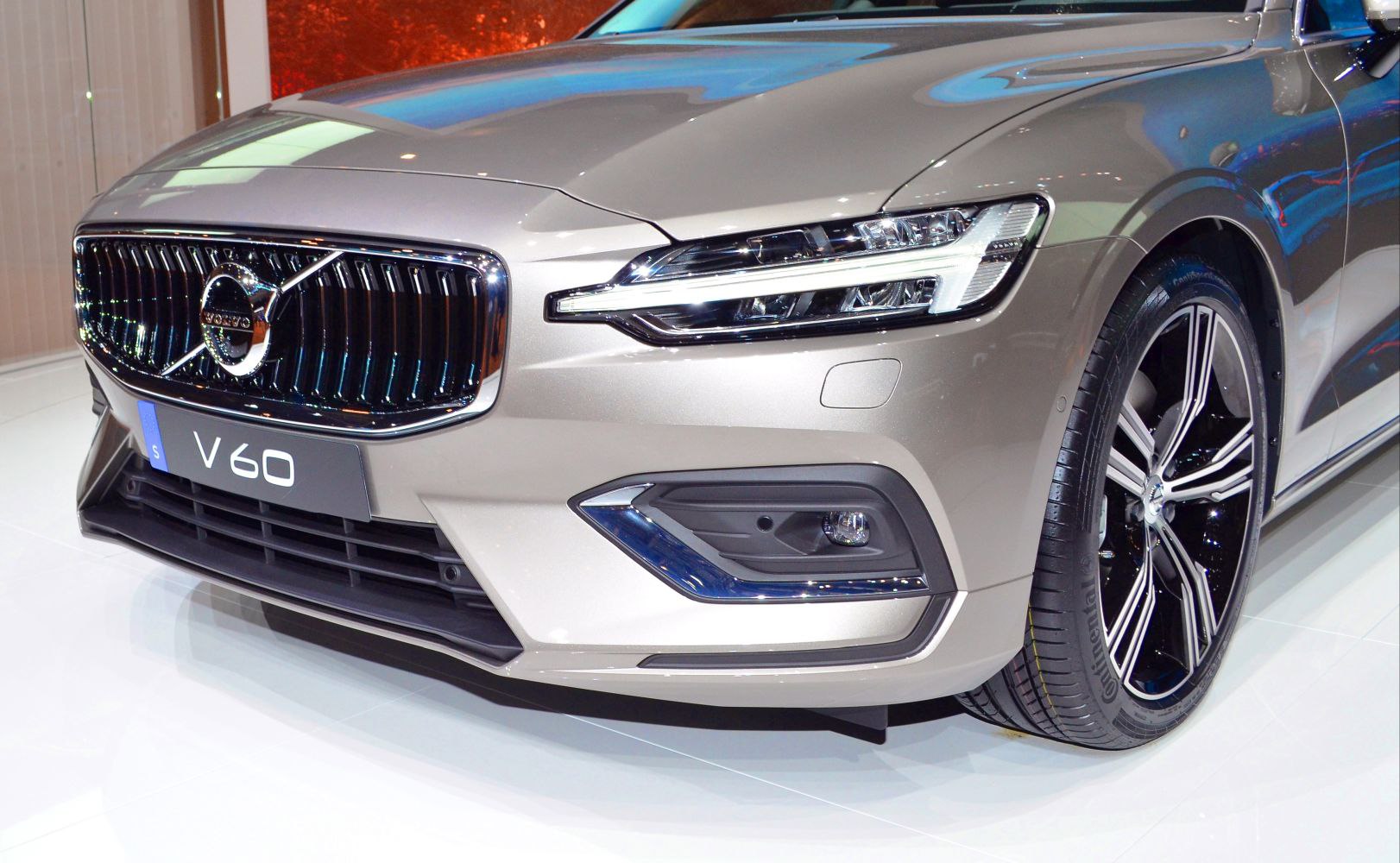 Close-up of front grille, LED headlight, and alloy wheel