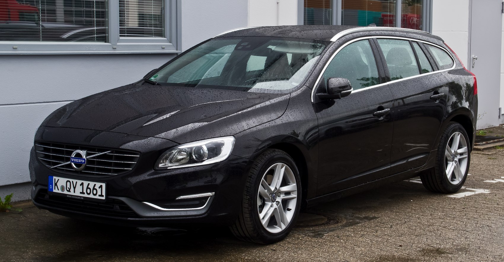 Front-side view of black station wagon with alloy wheels and modern headlights