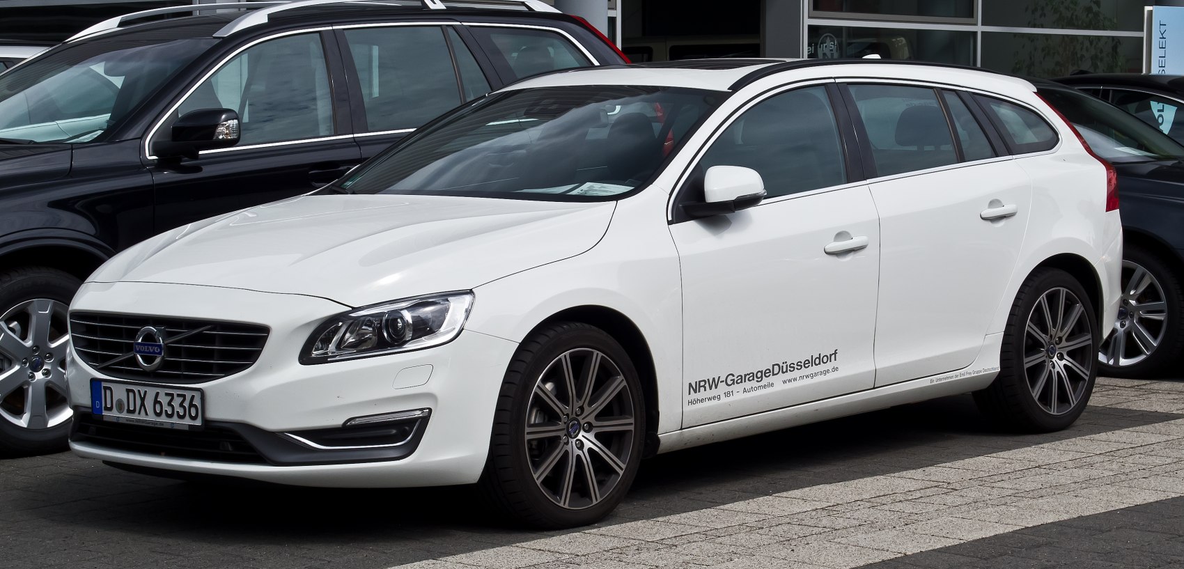 White wagon with modern LED headlights and alloy wheels