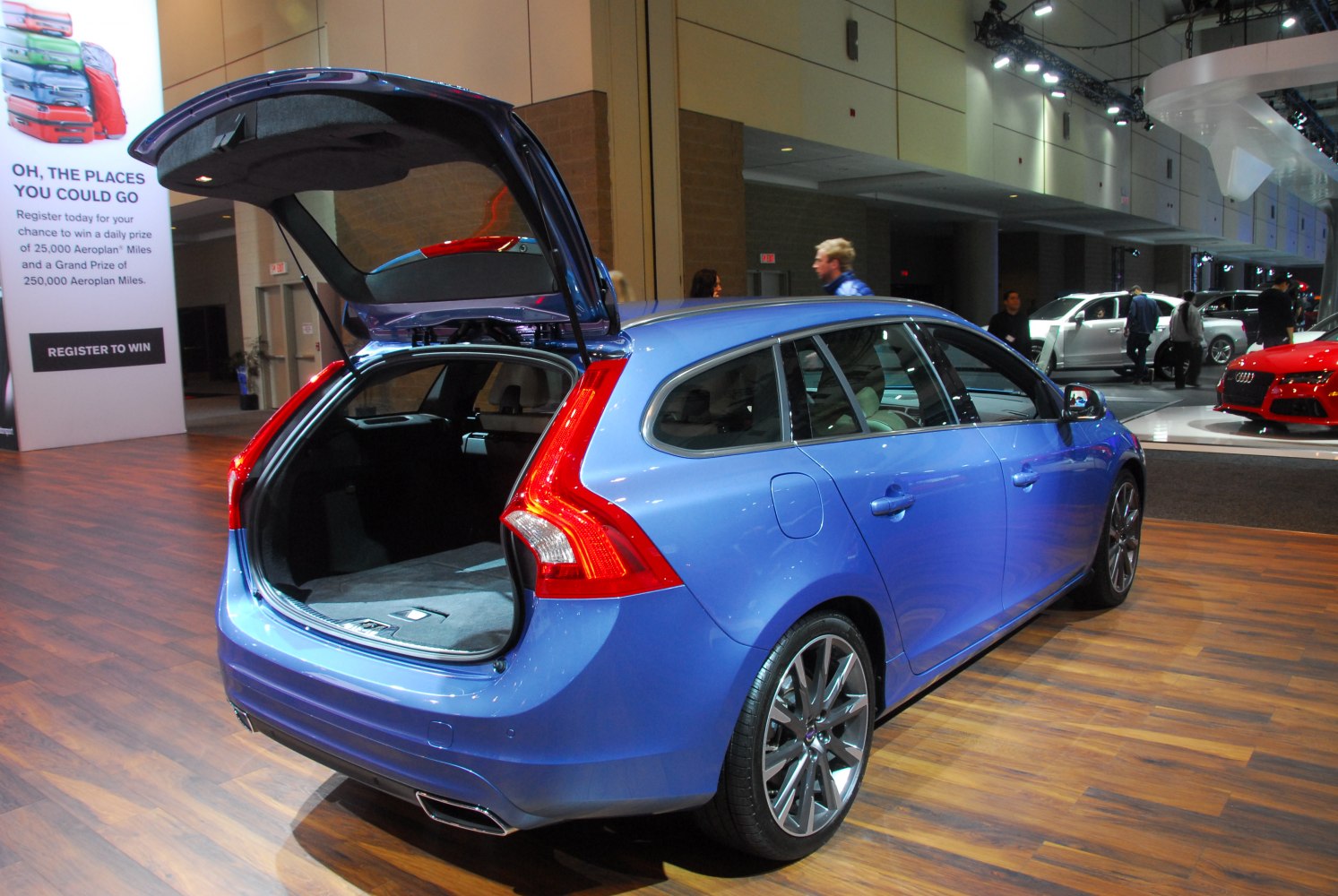 Open trunk and sporty rear design of blue estate car
