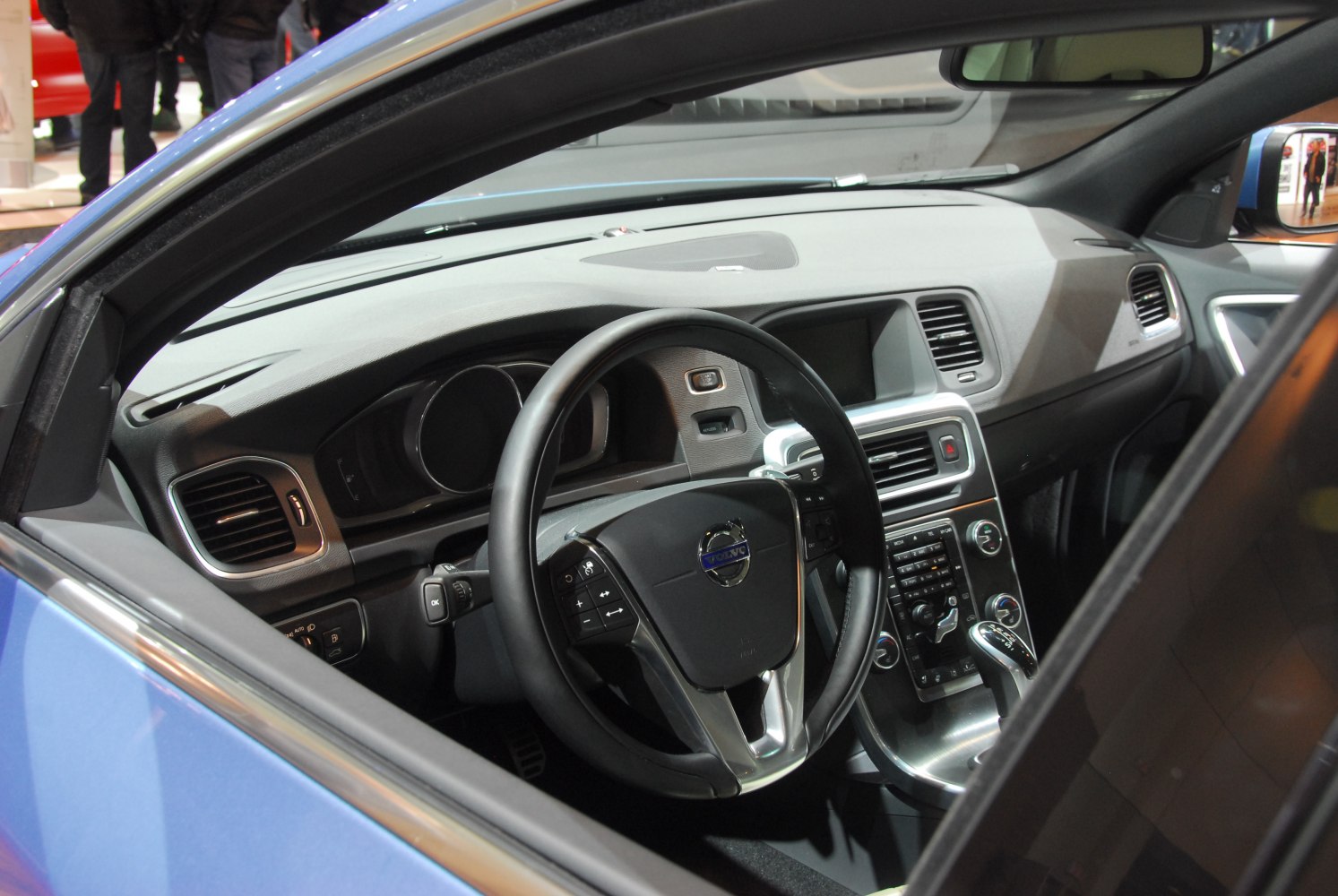 Steering wheel and dashboard interior with controls and display