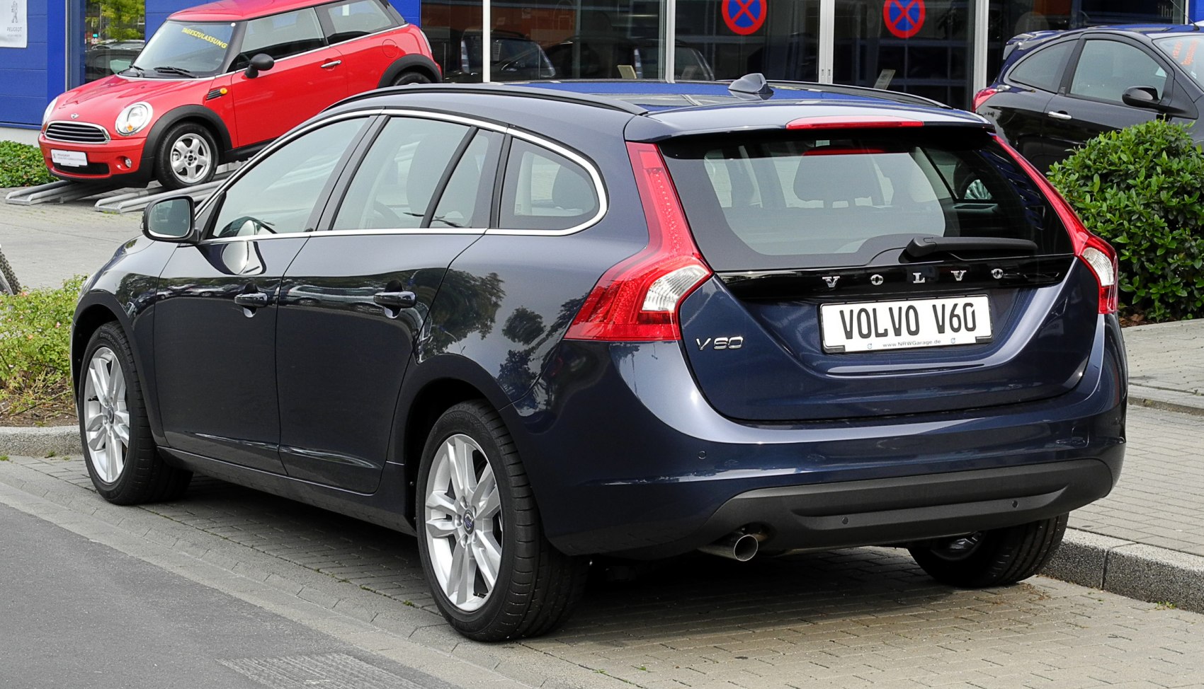 Rear view with vertical tail lights and hatchback design