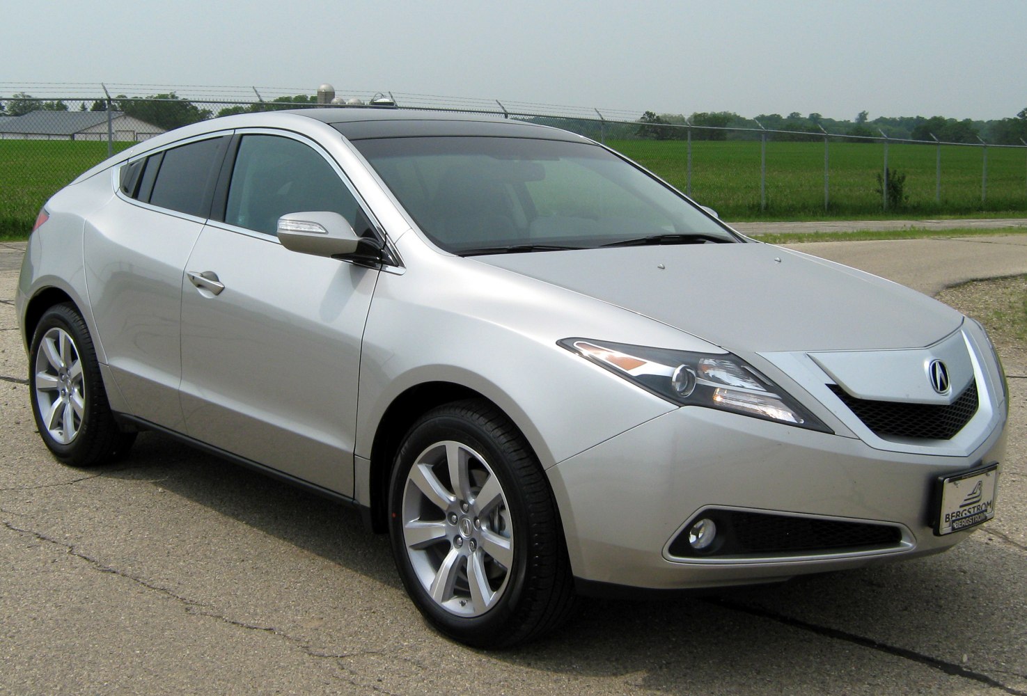 Silver car front 3/4 view with LED headlights and alloy wheels