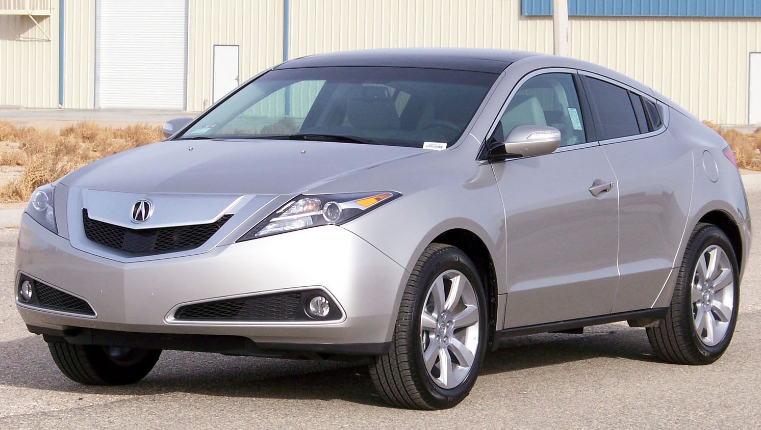 Sleek crossover SUV with coupe roofline and aggressive front fascia