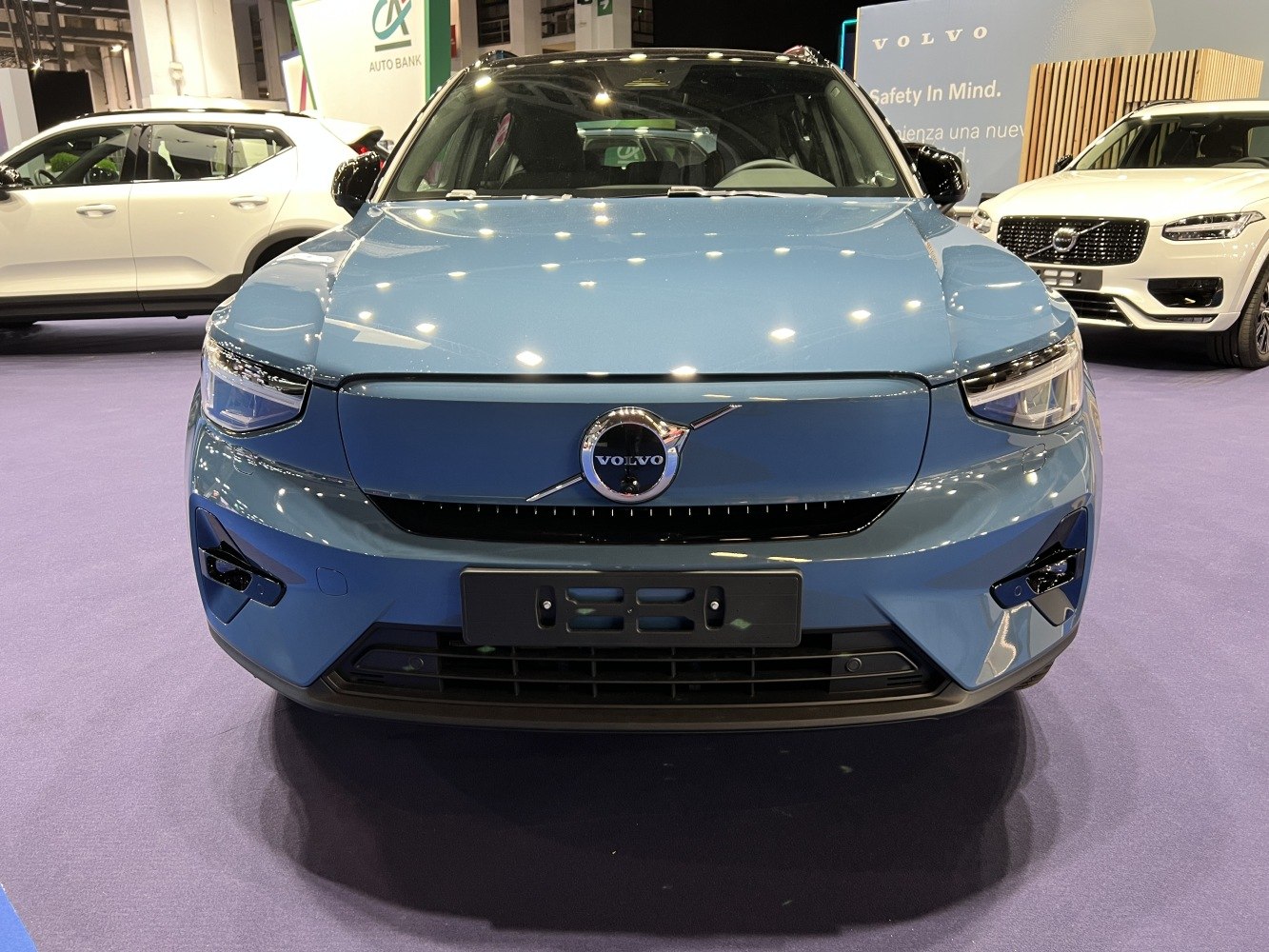 Closed grille and modern headlight design on front of electric SUV