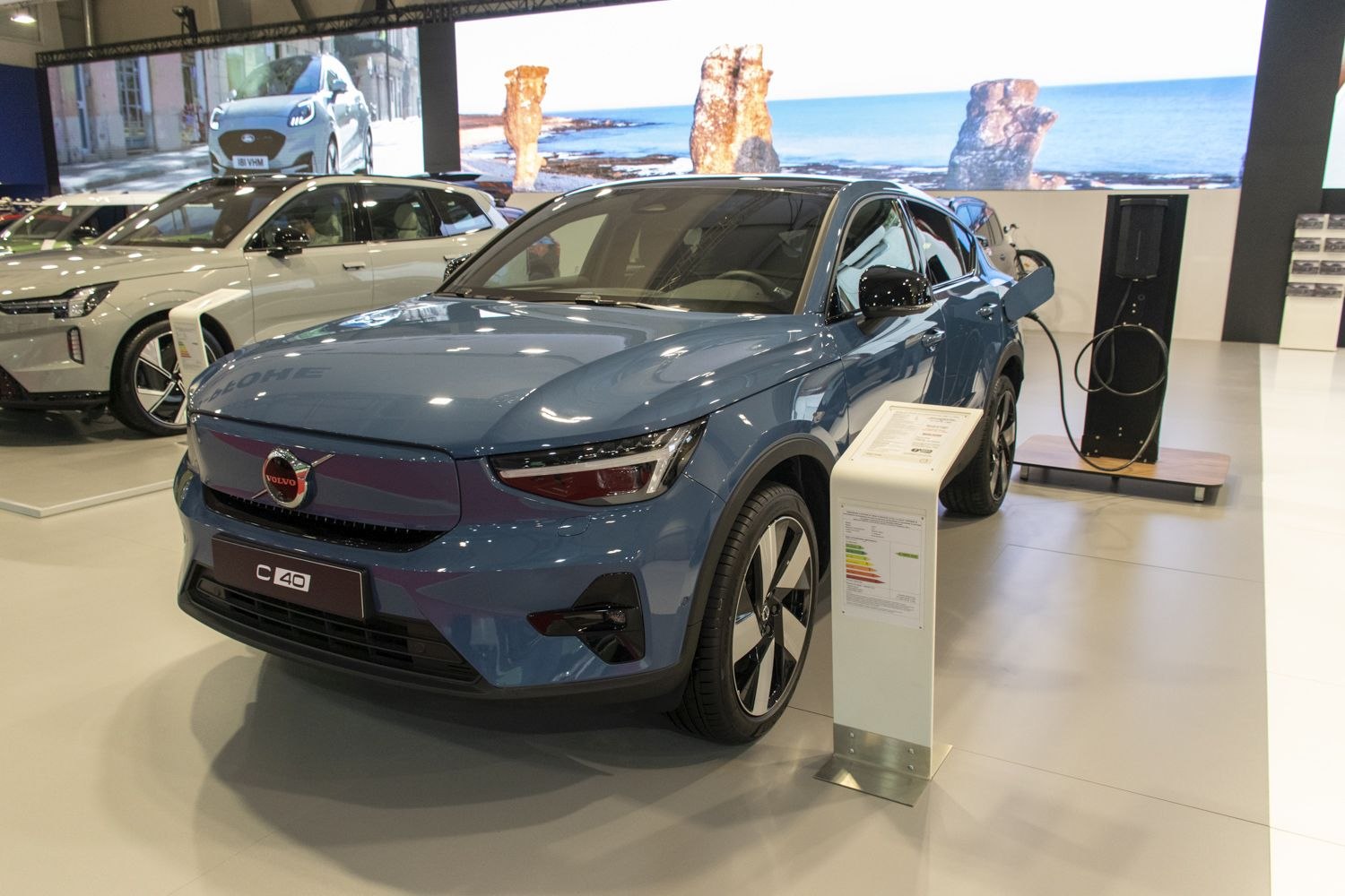 Electric SUV with sleek headlights and charging port