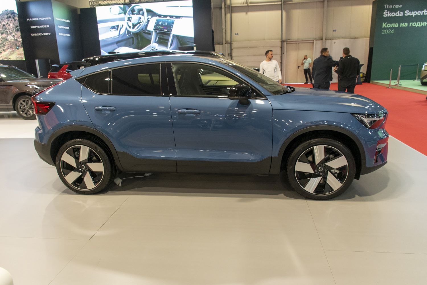 Sleek SUV side profile with distinctive two-tone alloy wheels.