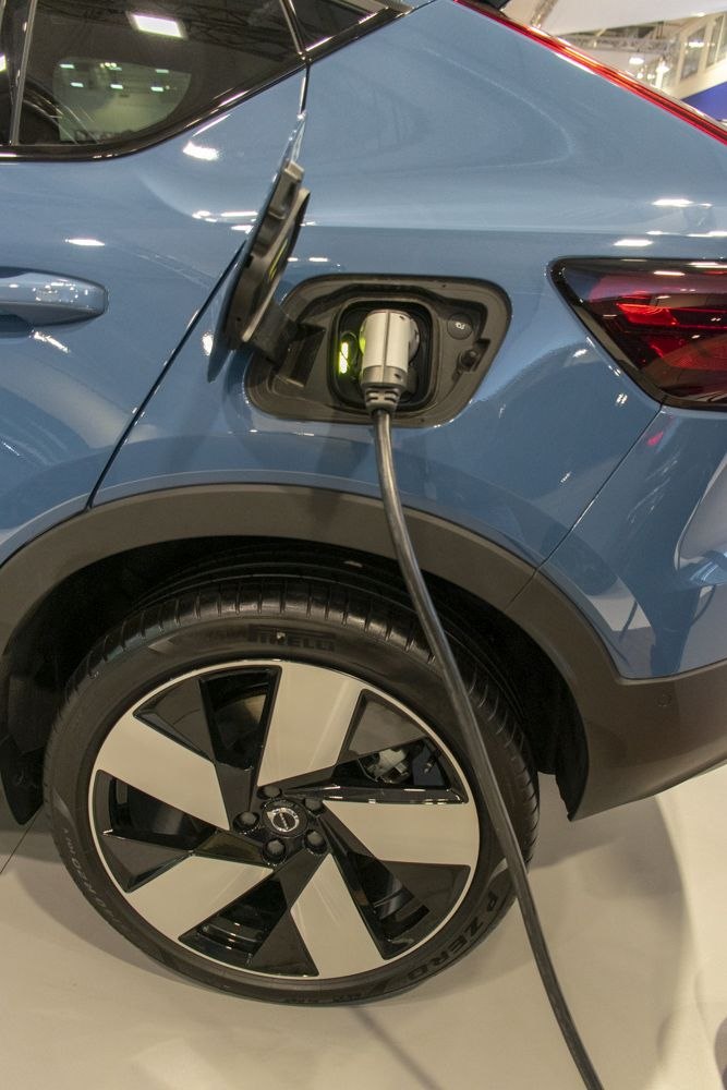 Electric charging port in use with alloy wheel on compact SUV