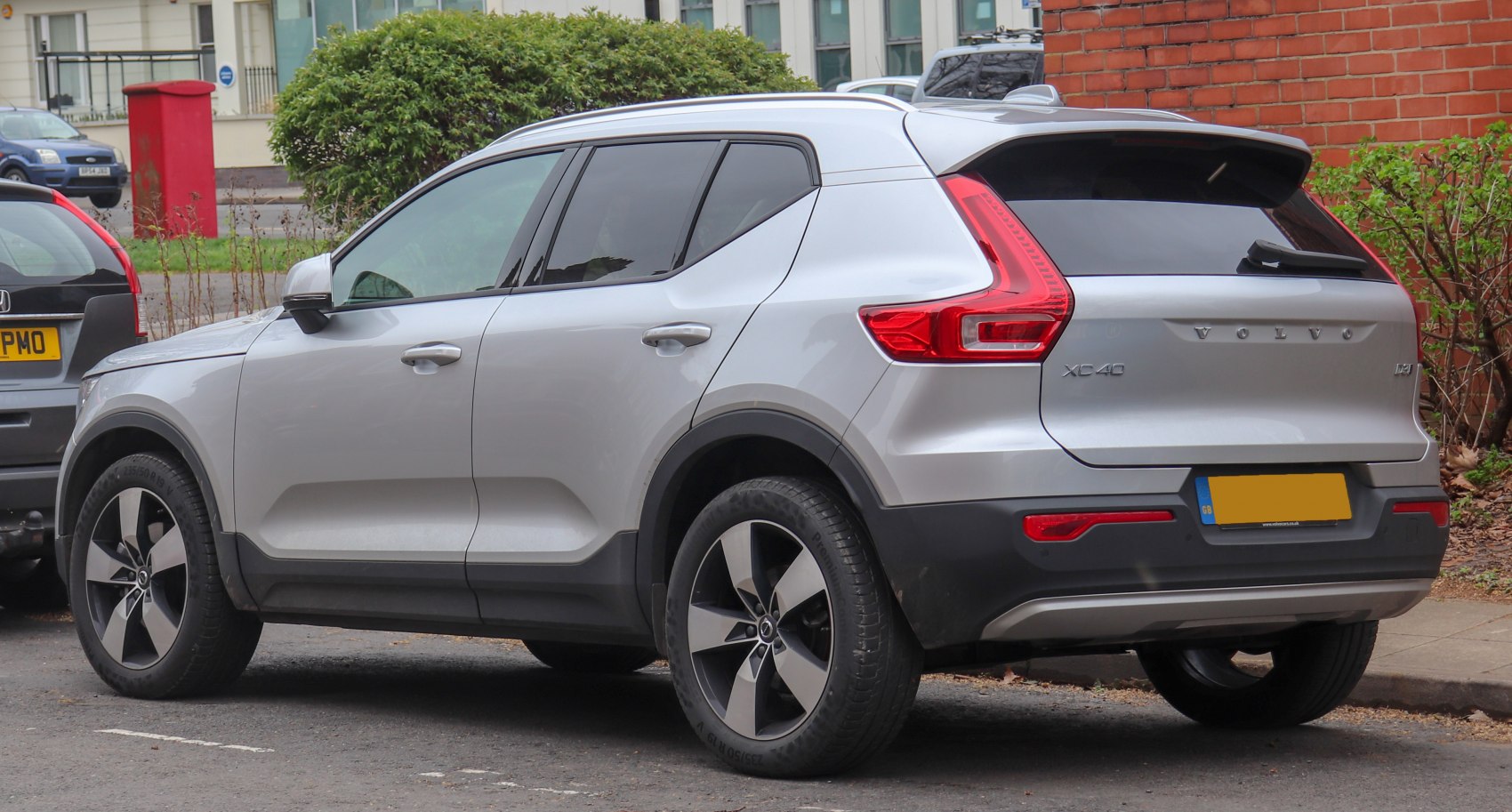 Rear side view with distinctive tail lights and alloy wheels