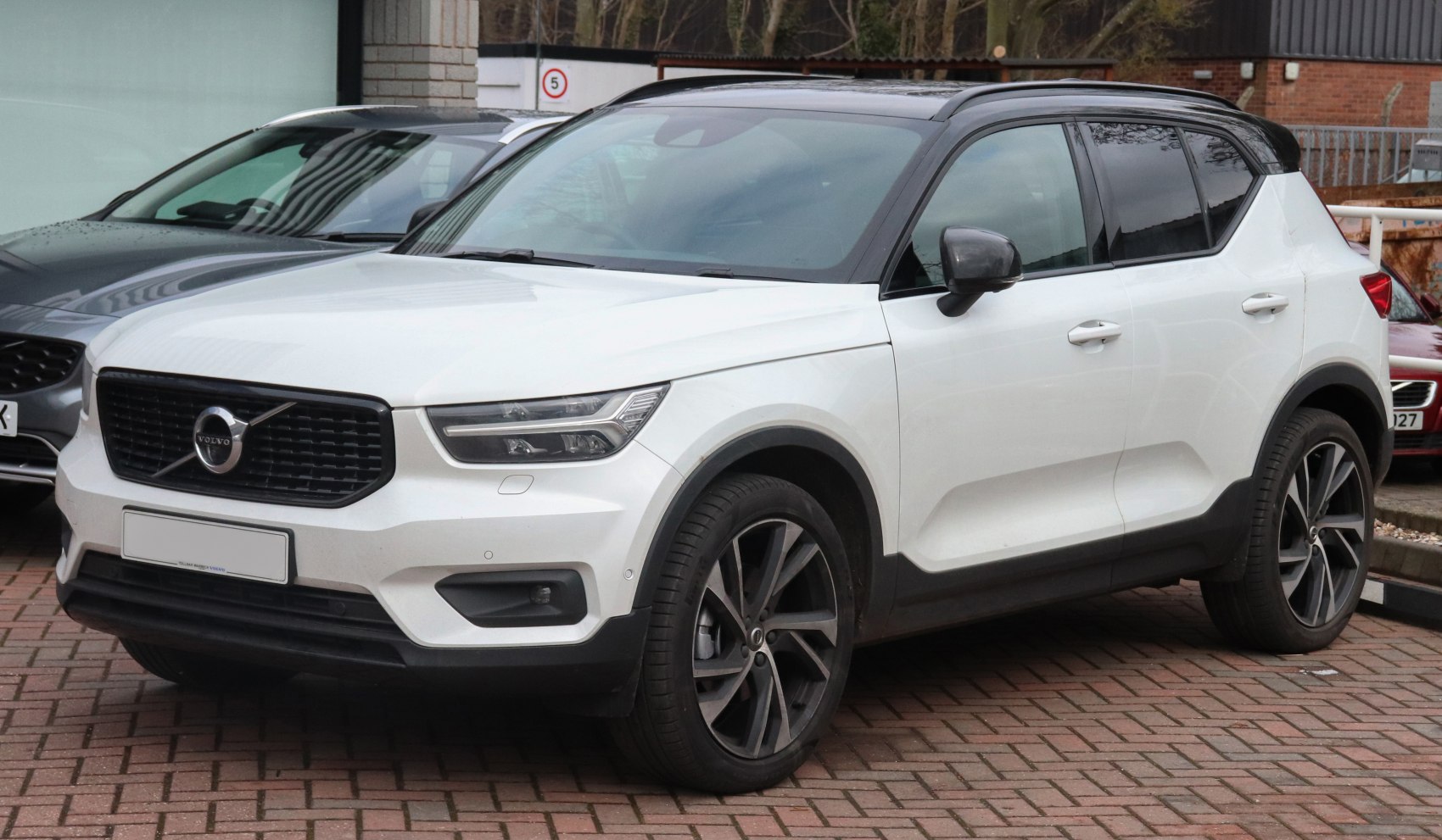 Compact SUV with sleek headlights, black grille, and two-tone roof