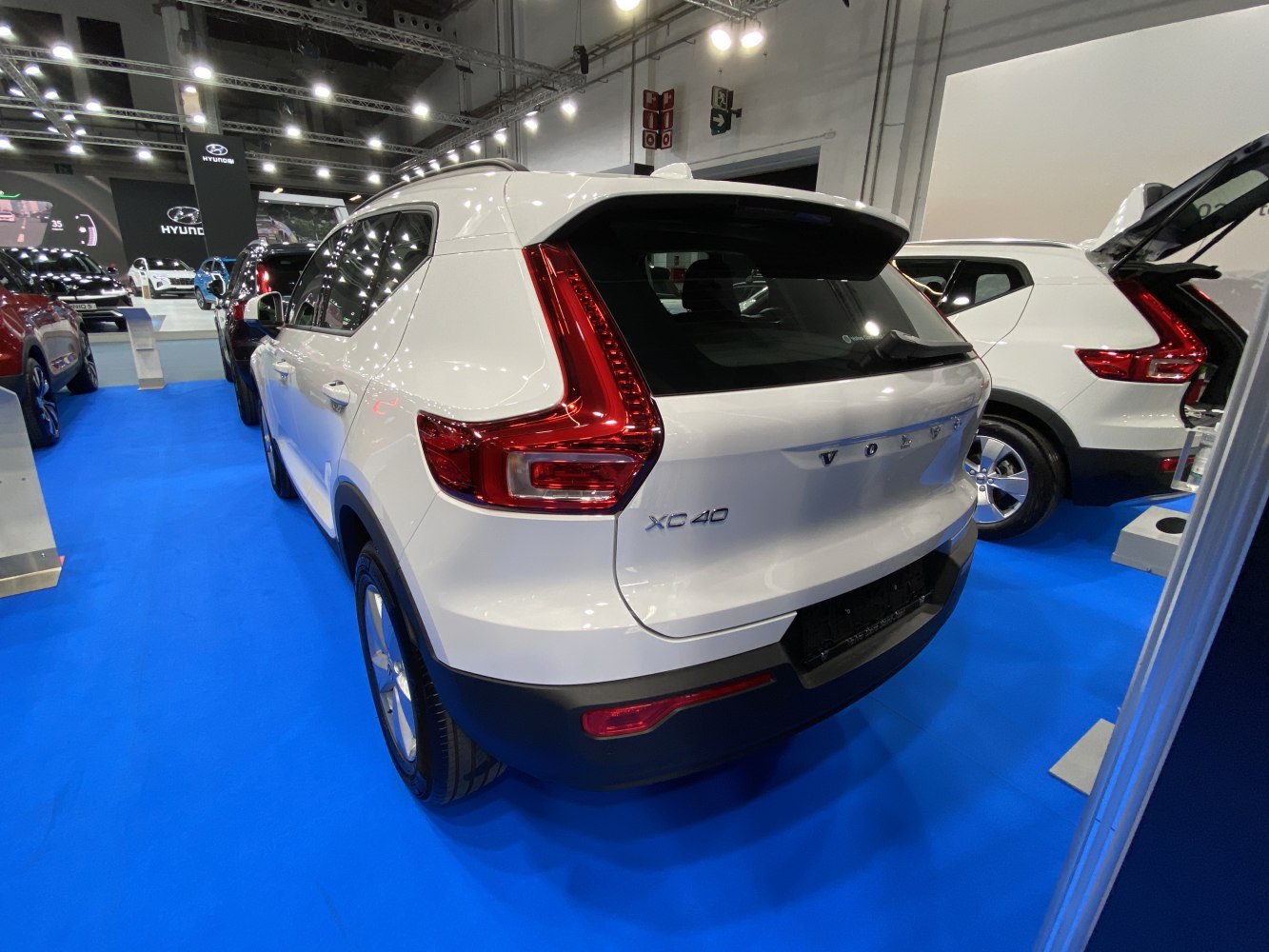 Rear view of a white SUV with distinctive L-shaped taillights