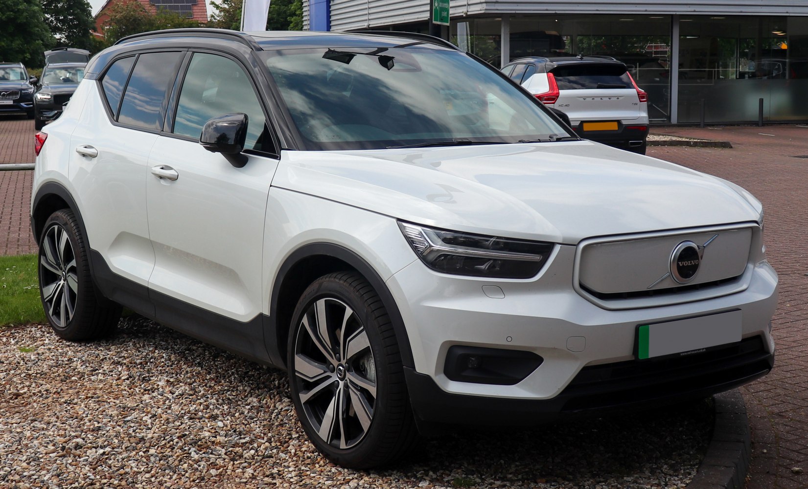 Front-side view with LED headlights and alloy wheels.