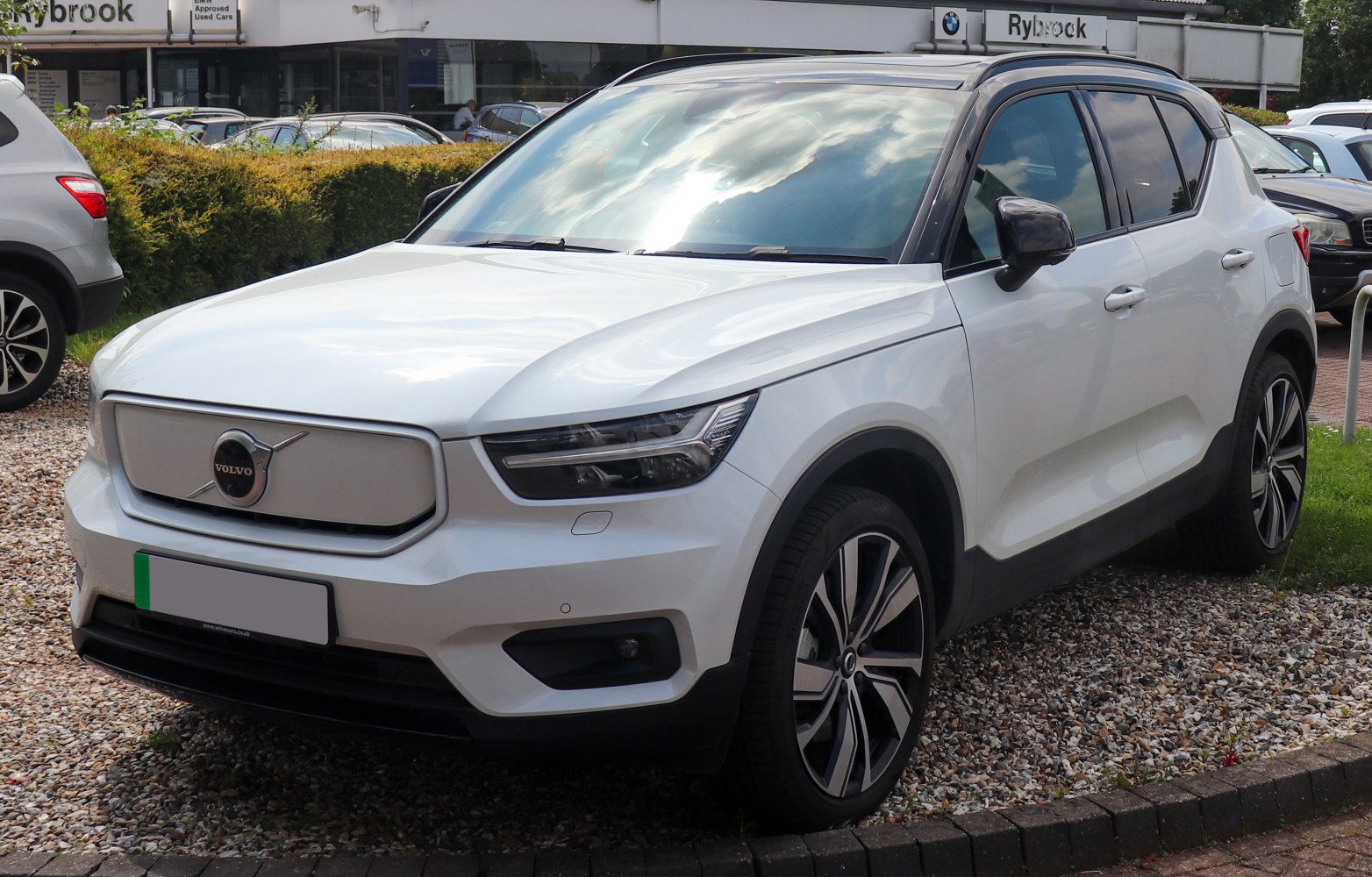 Sharp LED headlights and closed grille on modern SUV front