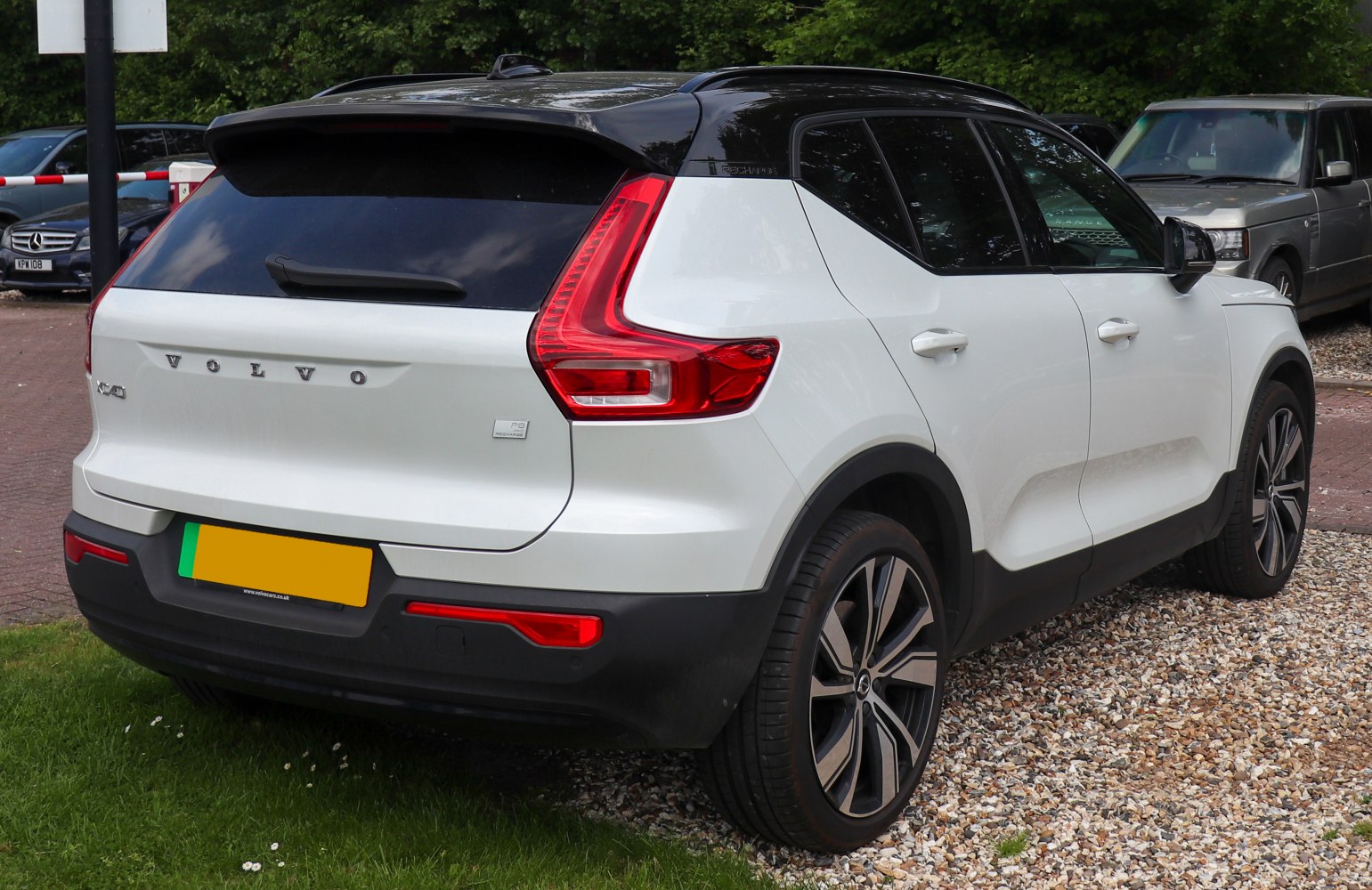 Rear view with vertical taillights and black roof contrast