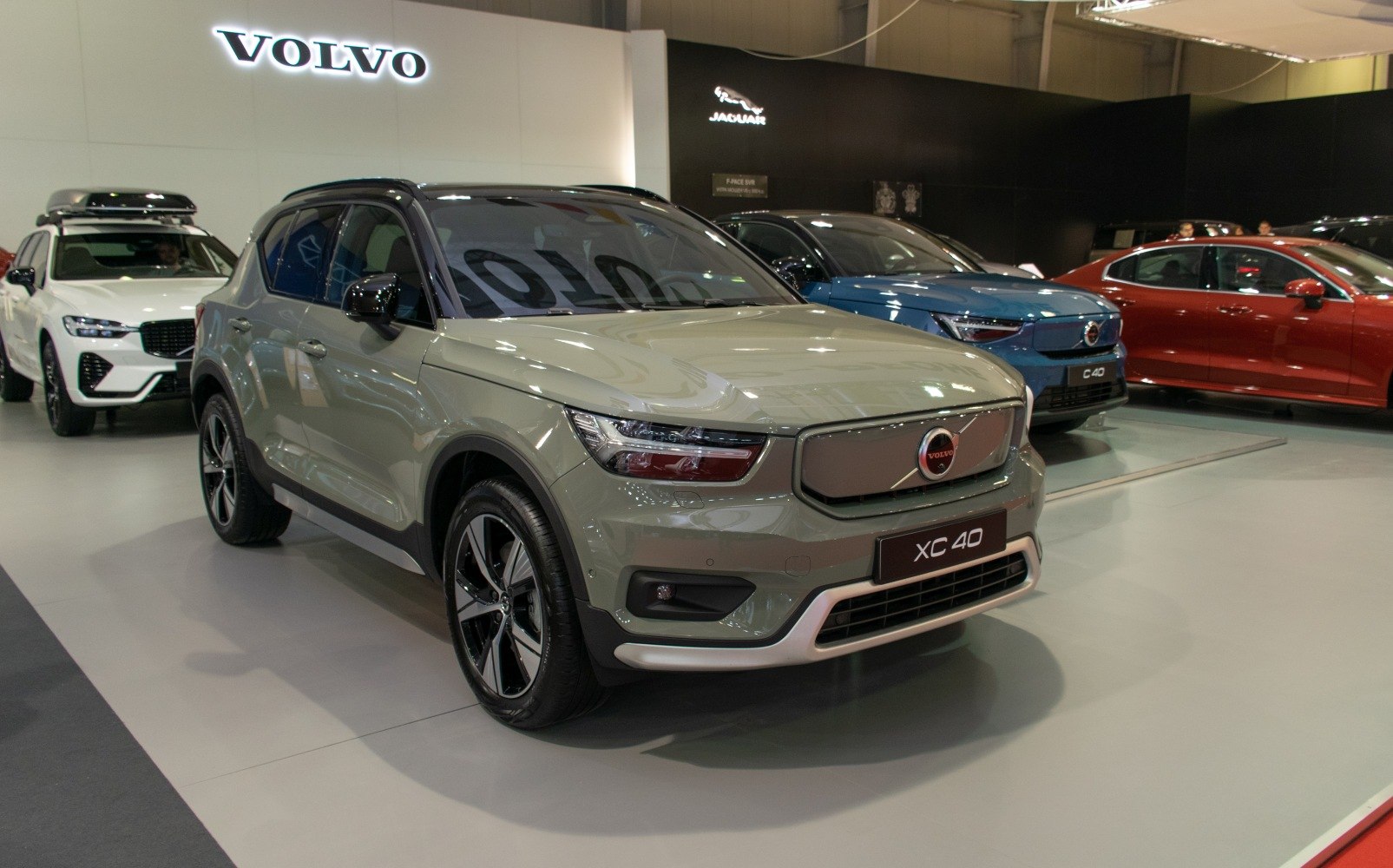 Front and side view of an electric SUV with modern headlights and alloy wheels