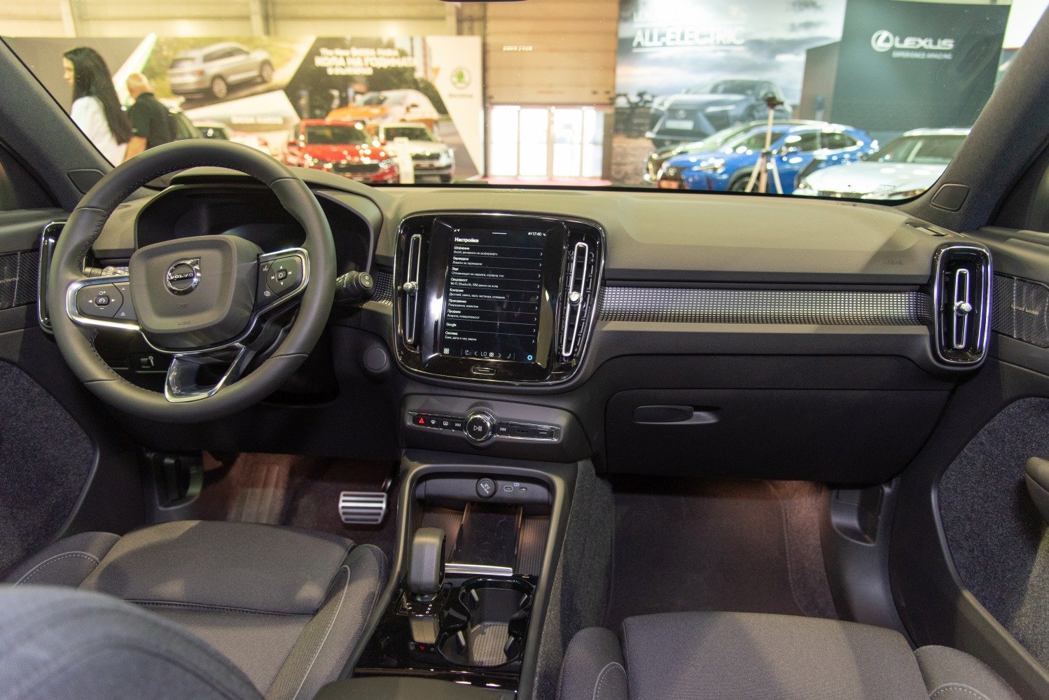 Digital touchscreen and multifunction steering wheel in modern car interior