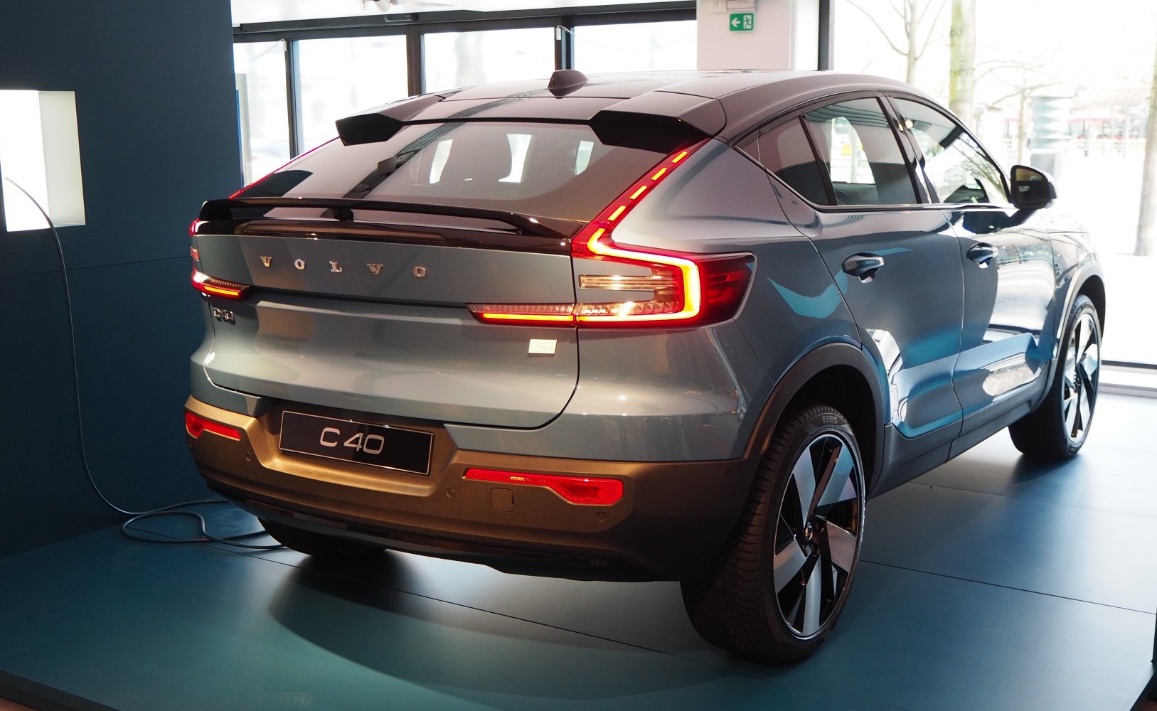 Rear view of electric car with LED taillights and charging port