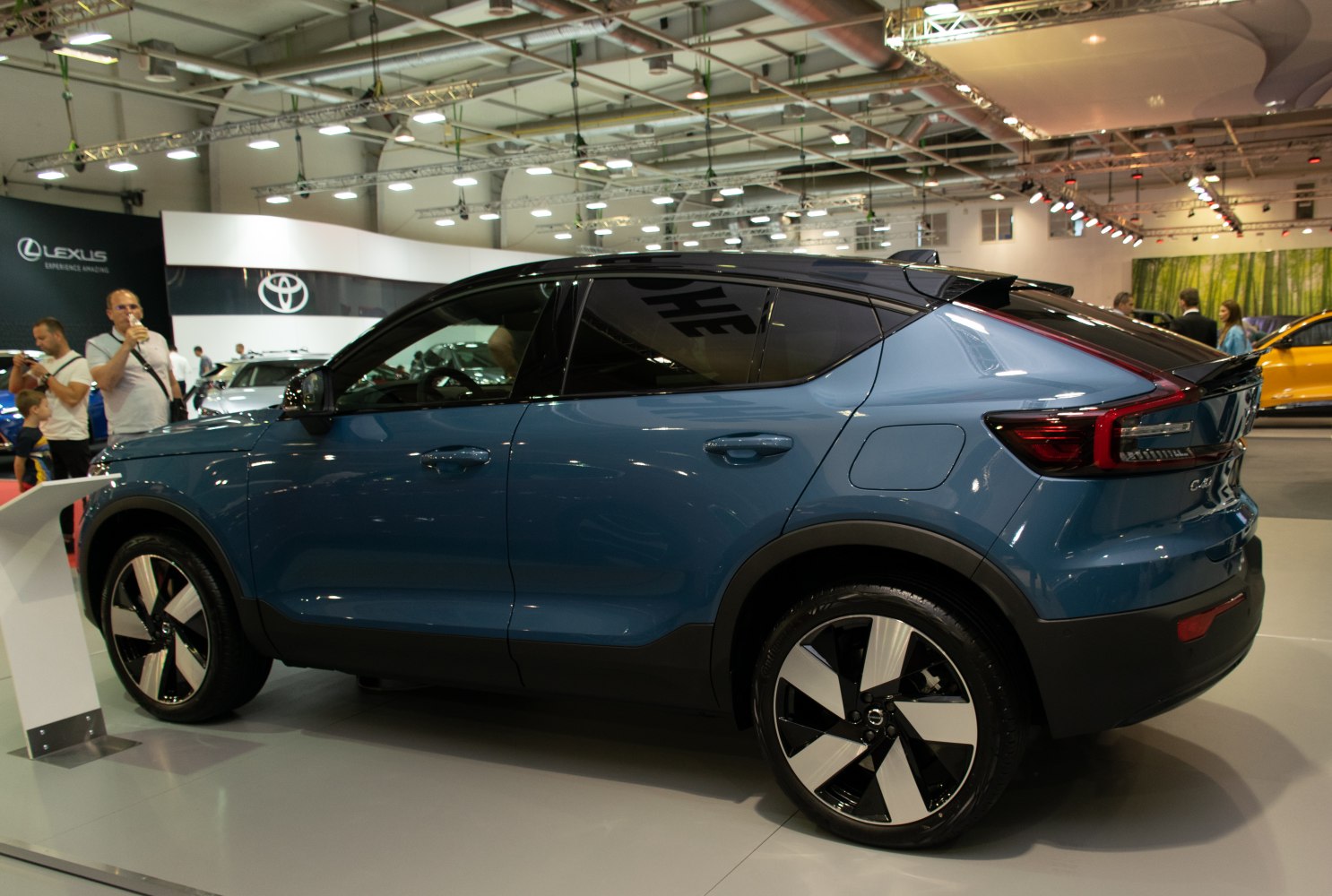 Electric SUV side and rear profile with alloy wheels and tinted windows.