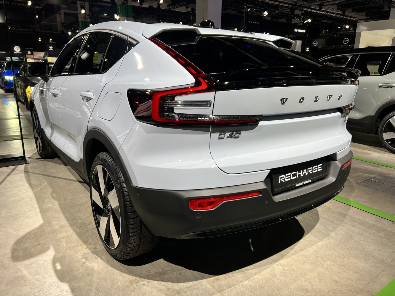 Rear side view with distinctive tail lights and sporty electric SUV design.