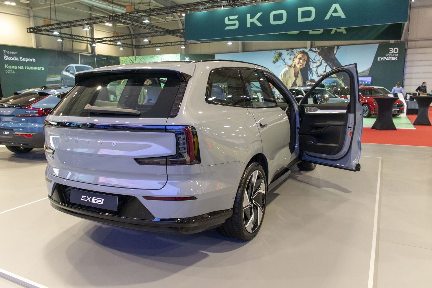 Rear and side view of SUV with open door and modern taillights