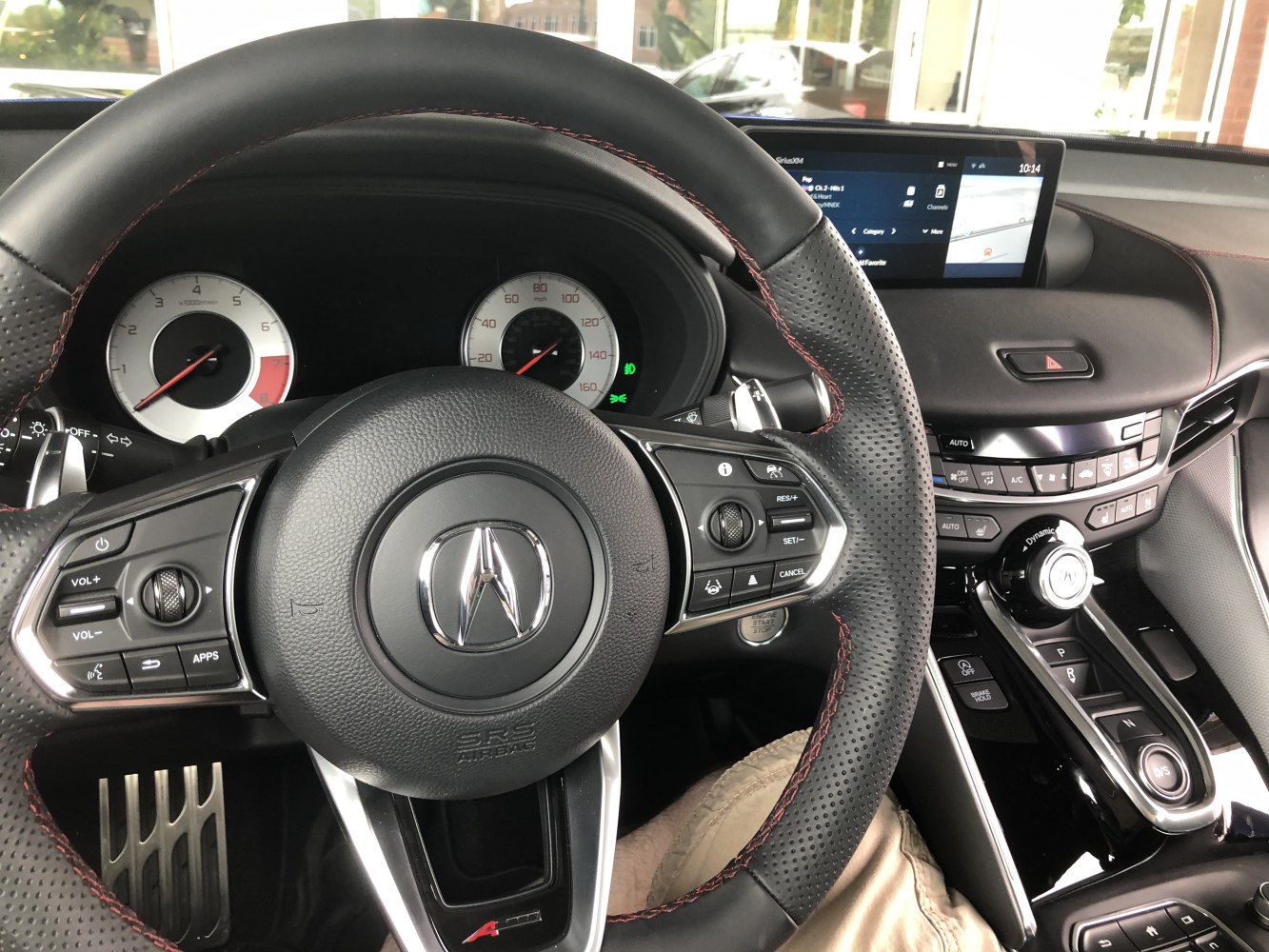 Steering wheel with control buttons and digital instrument cluster