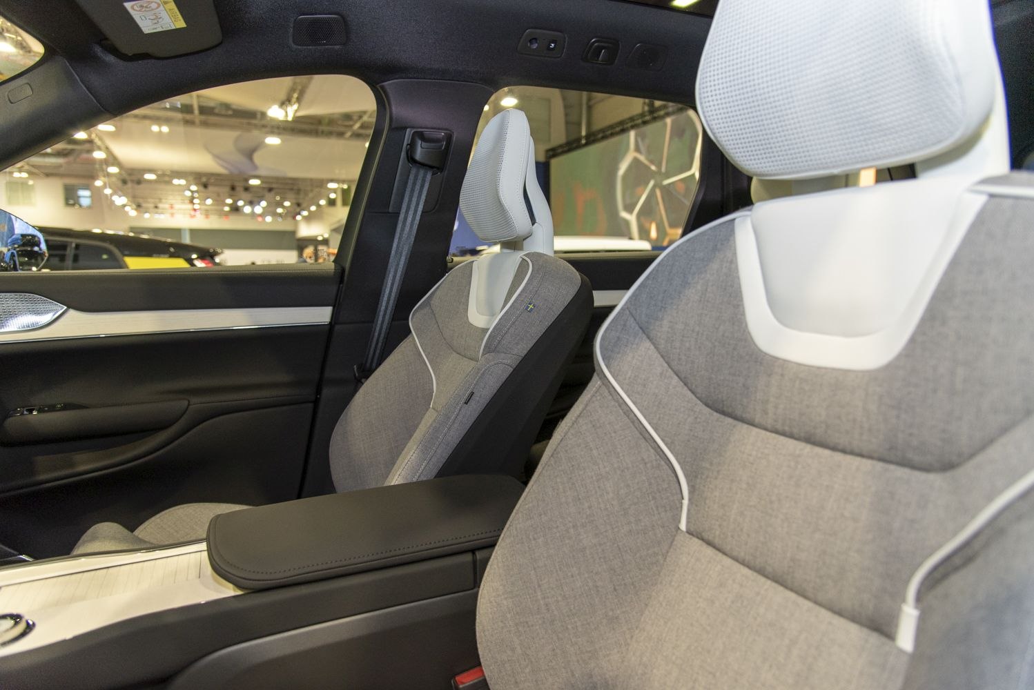 Fabric seats with white headrests and contrast piping in front car interior