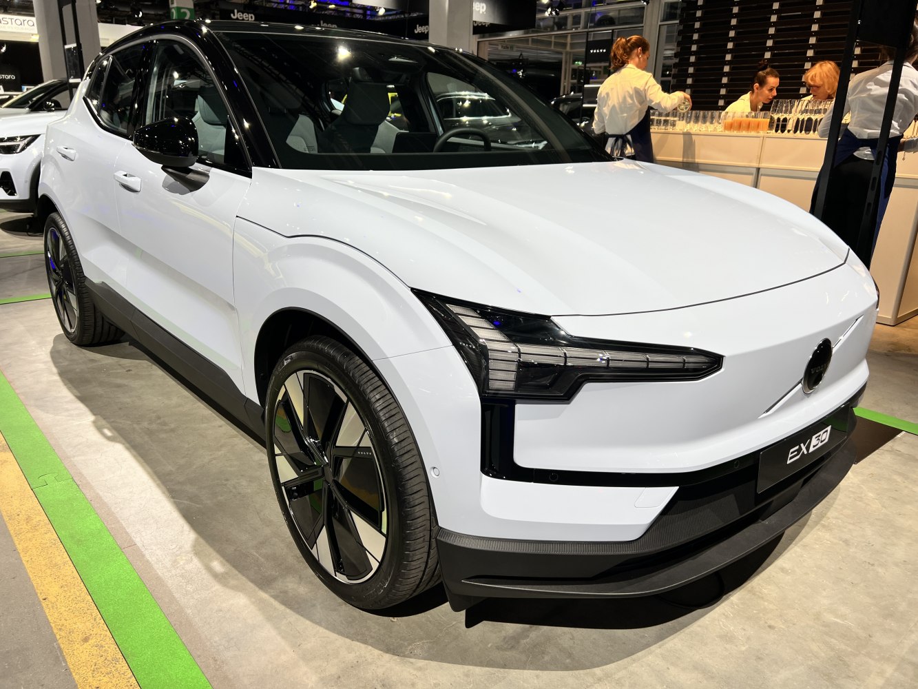 Front side view of a modern electric SUV with LED headlights and aerodynamic styling