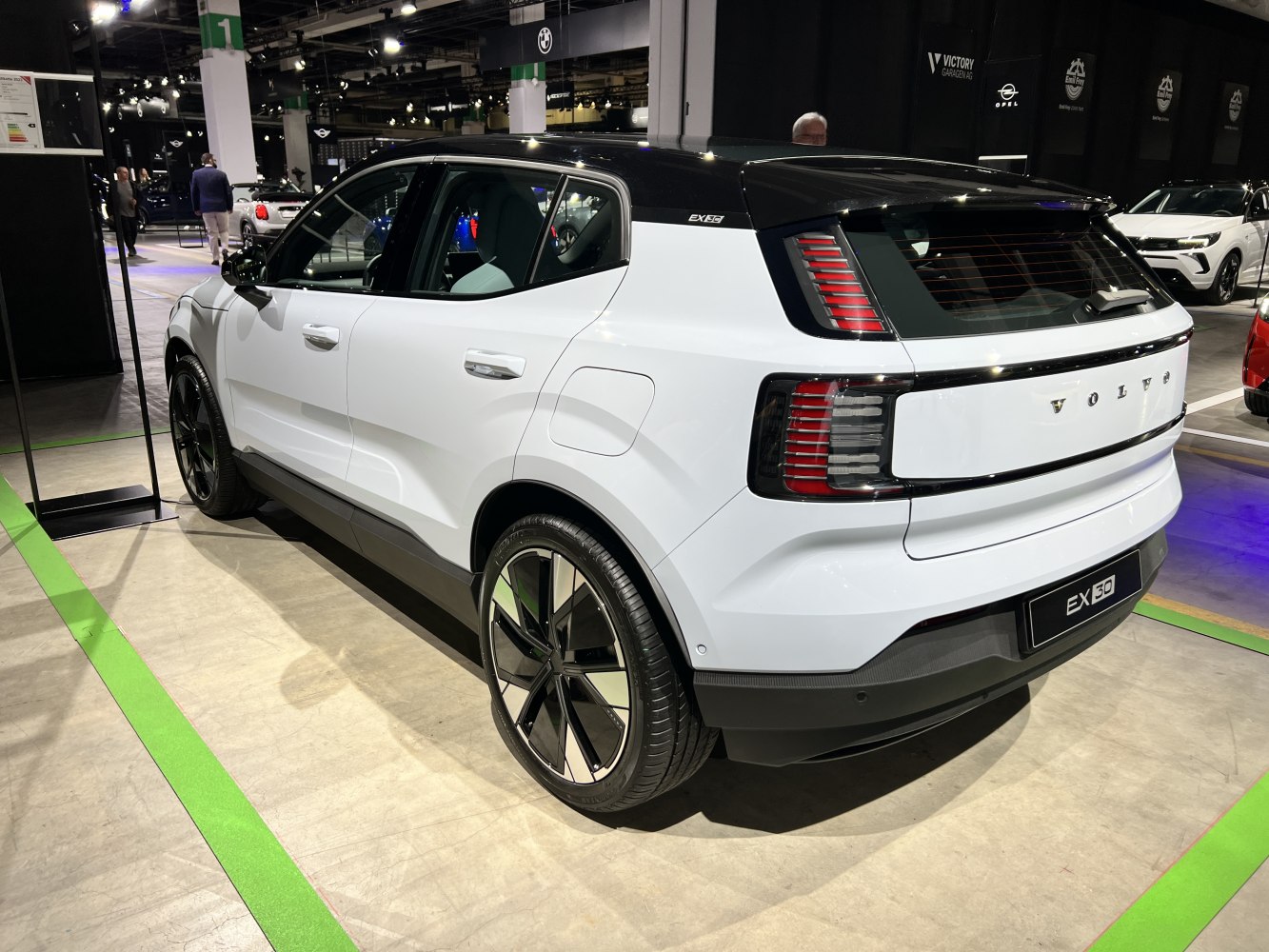 Rear side view of electric SUV with distinctive taillights and sleek roof design