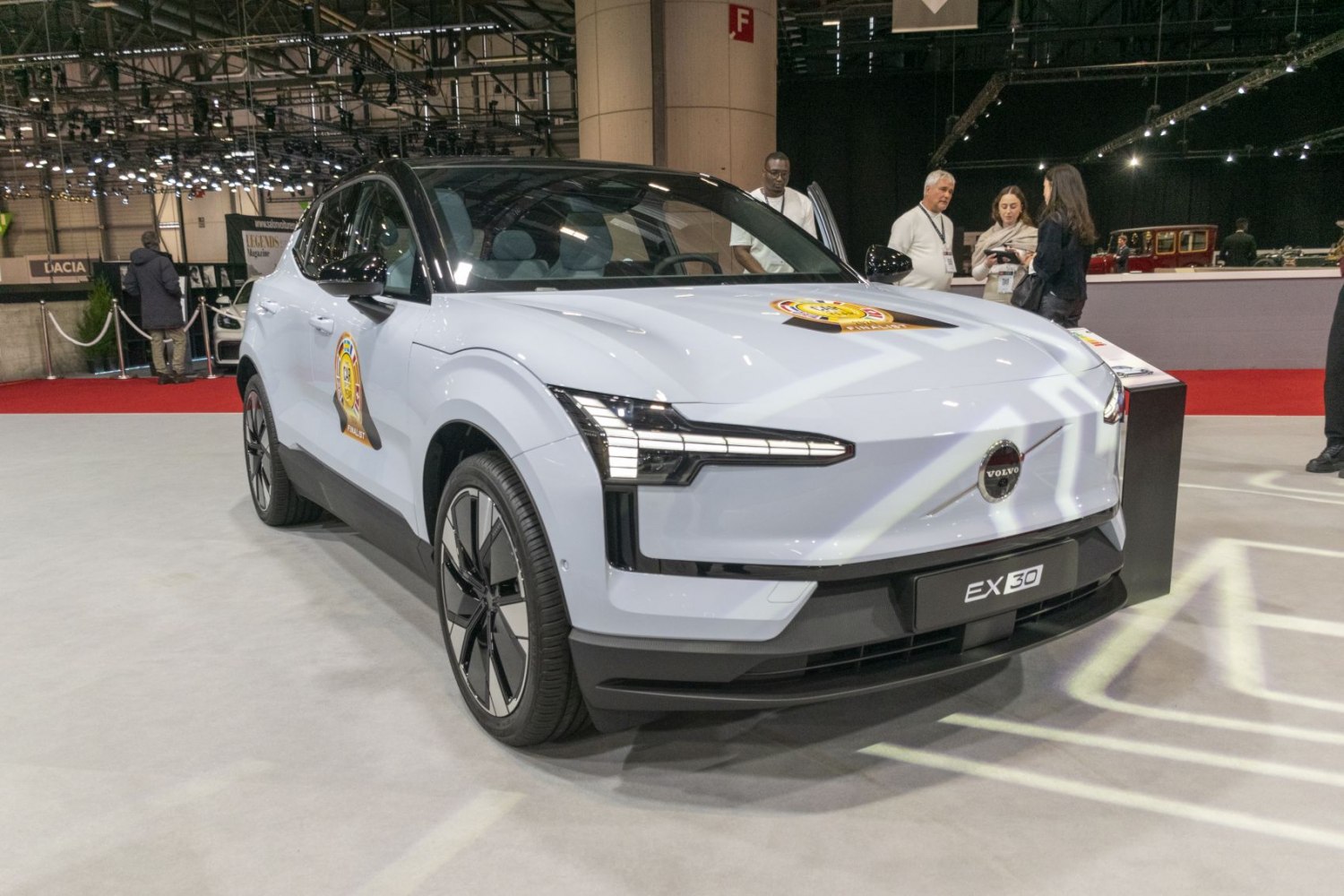 Front view of electric SUV with sharp LED headlights and aerodynamic design