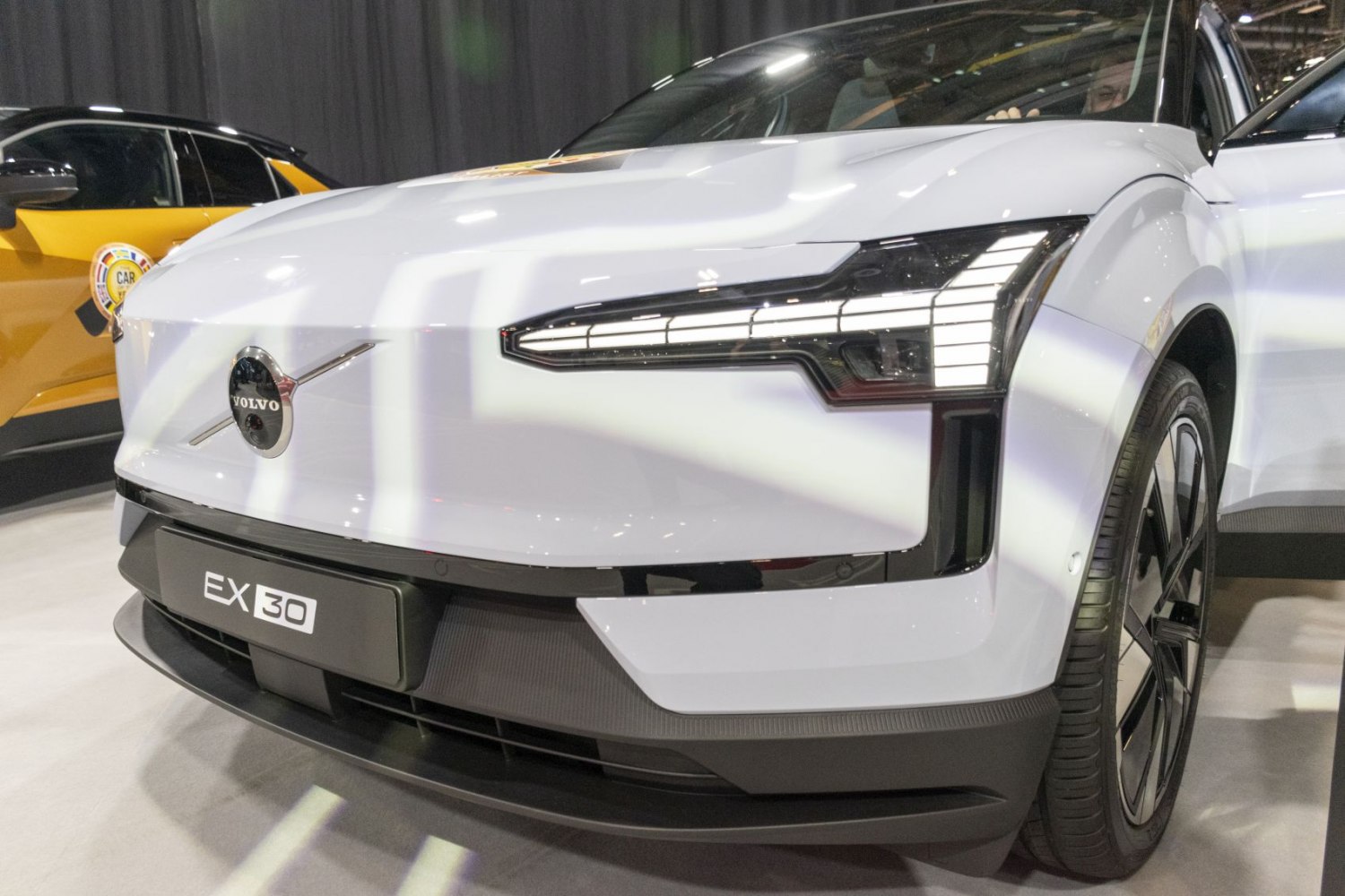 Close-up of white front end and LED headlights.