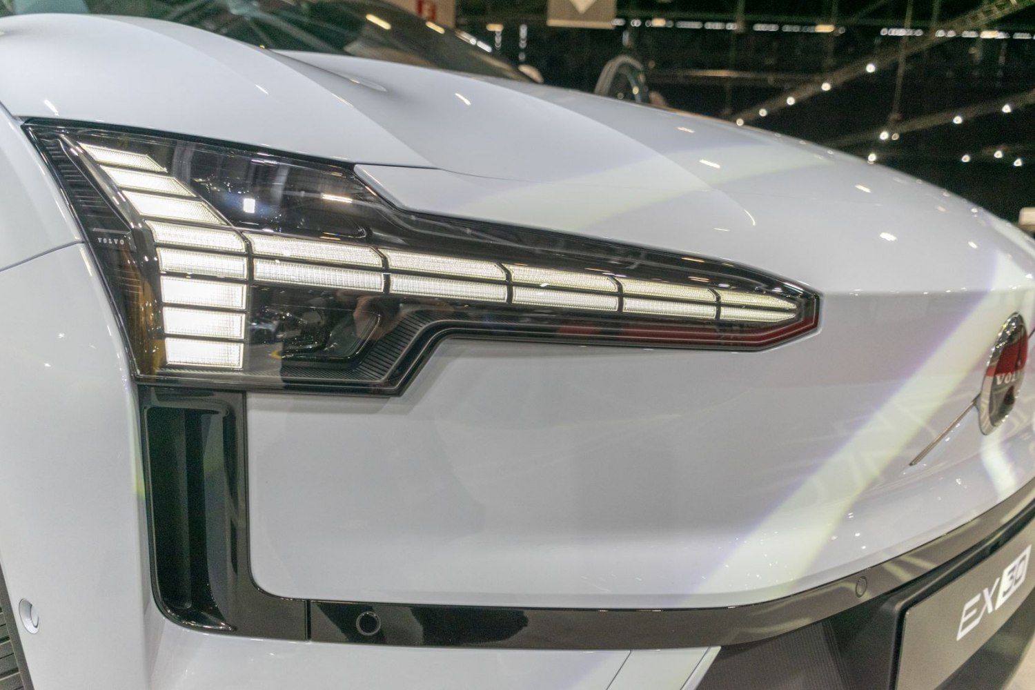 Close-up of Volvo EX30 2024 LED headlight design, modern front lighting.