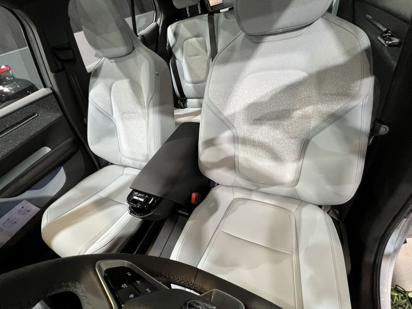 White seats and sleek center console with modern ergonomic design
