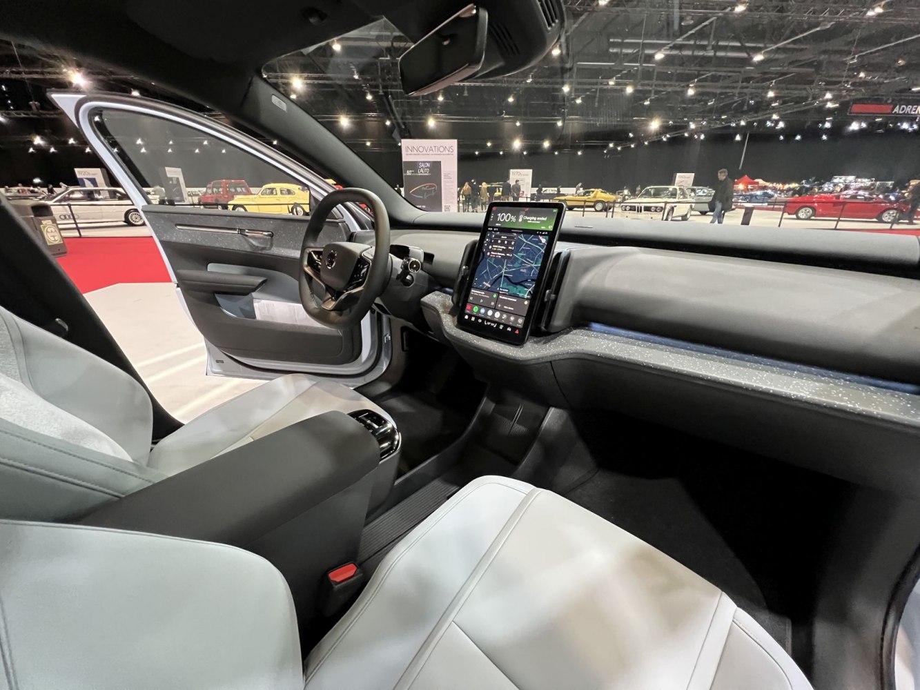 Modern car interior with vertical touchscreen and sleek dashboard