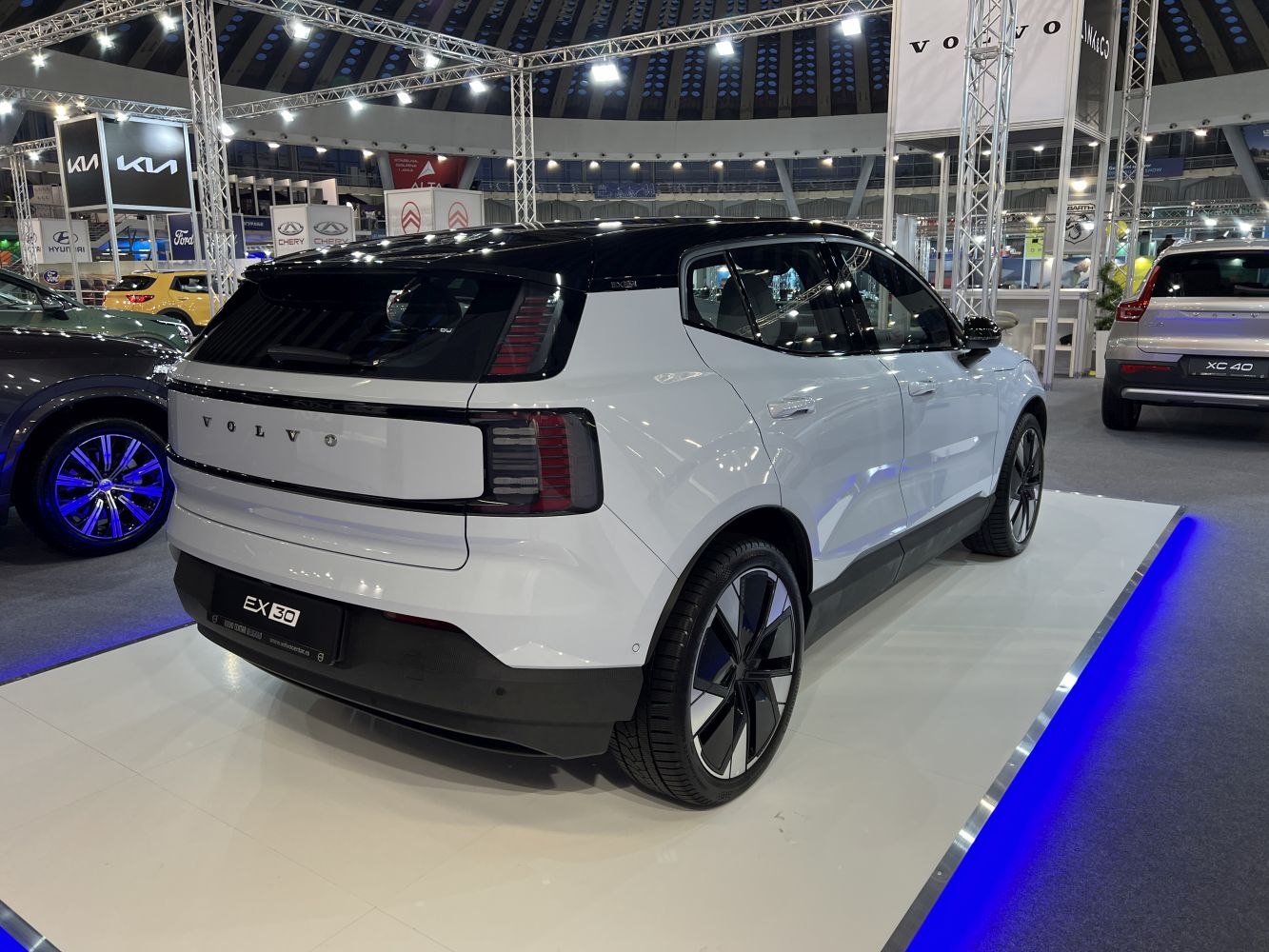 Rear view with sleek tail lights and two-tone roof design