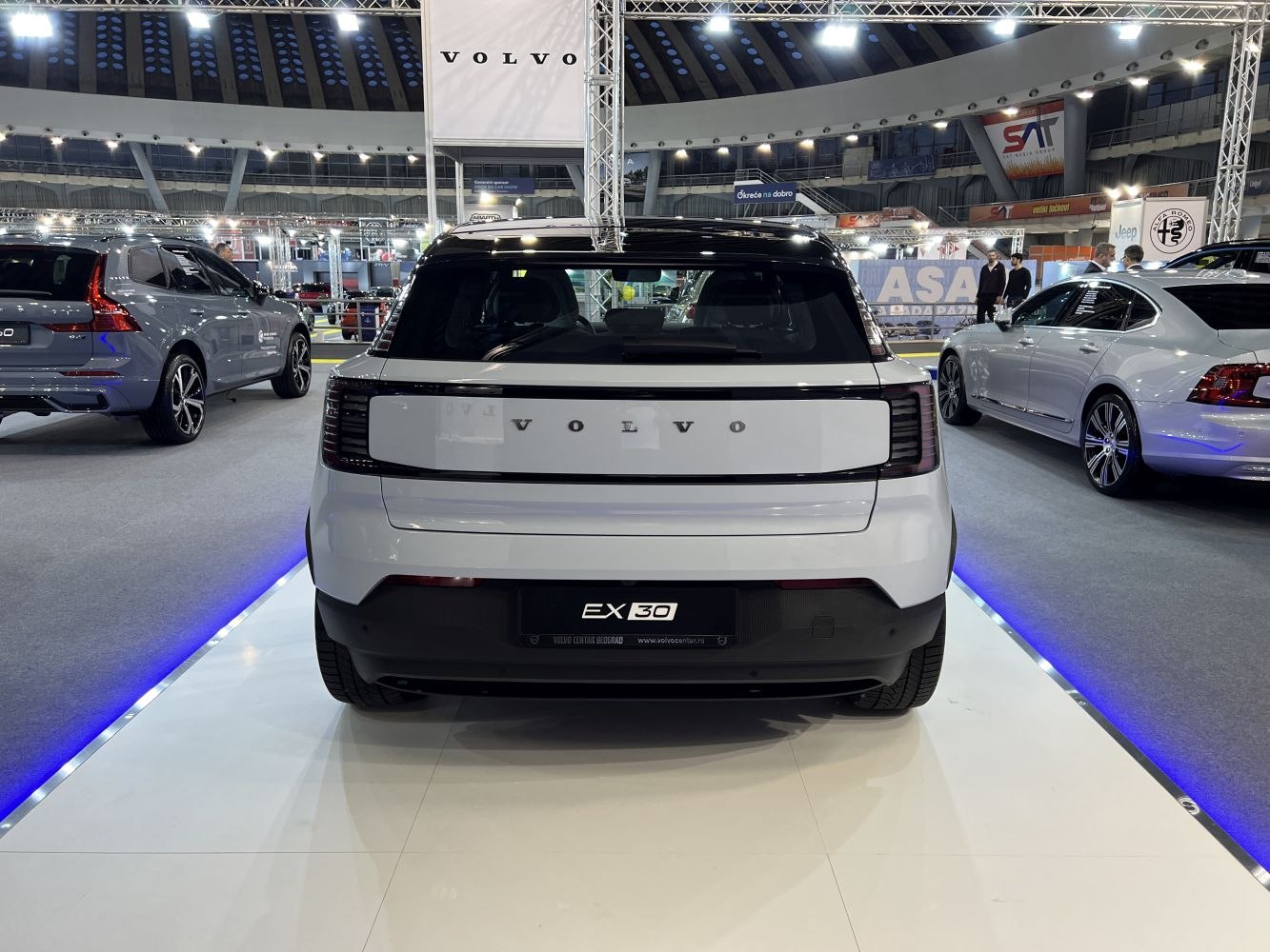 Rear view of a modern compact electric SUV with distinctive horizontal taillights.