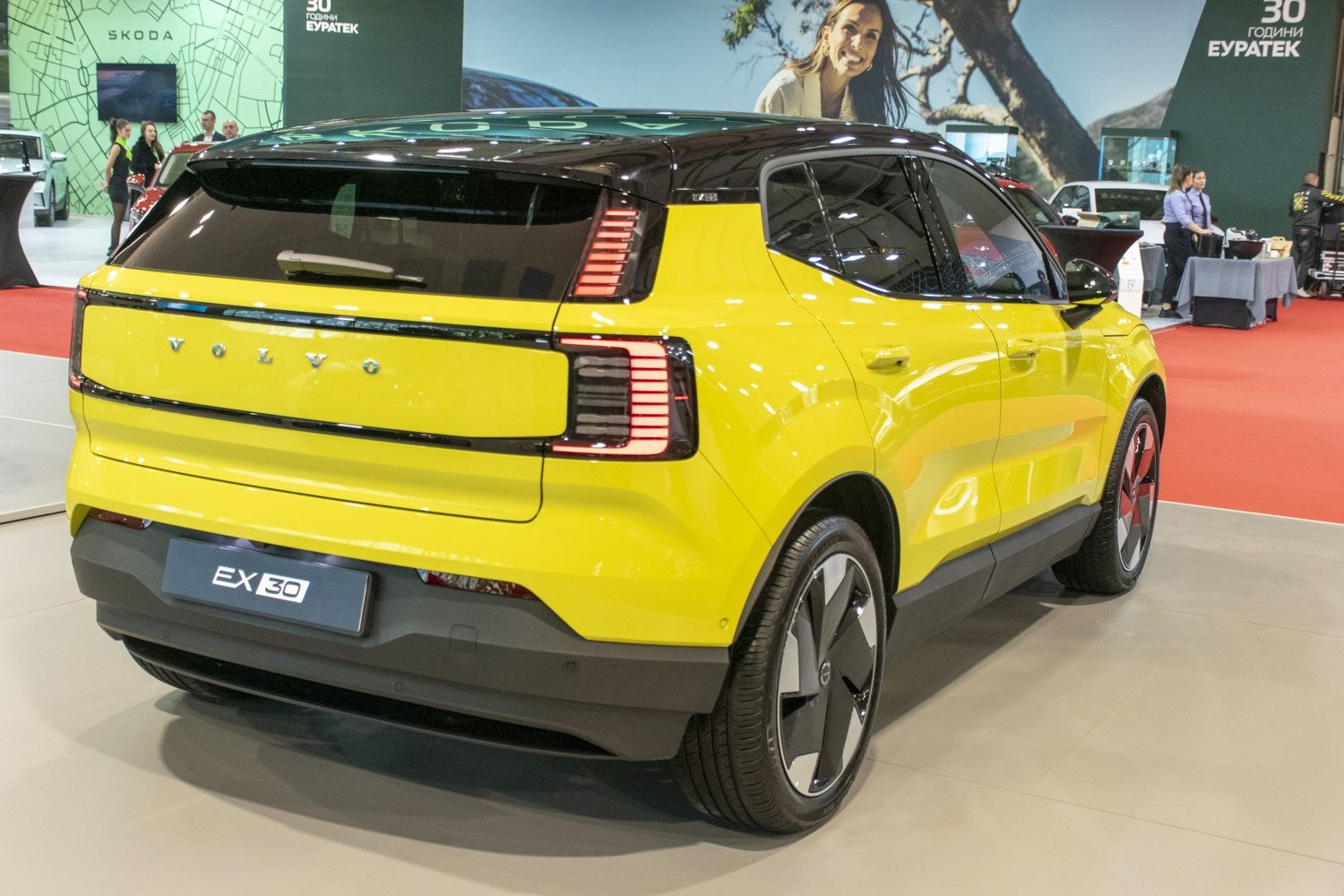 Rear side of yellow compact SUV with vertical LED tail lights and two-tone roof