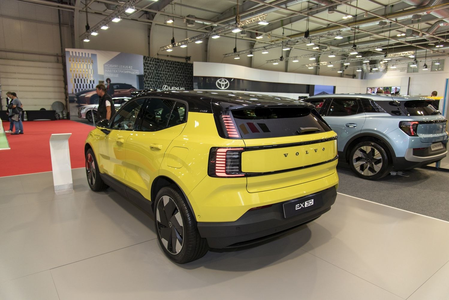 Yellow compact SUV rear with vertical LED tail lights and black roof contrast