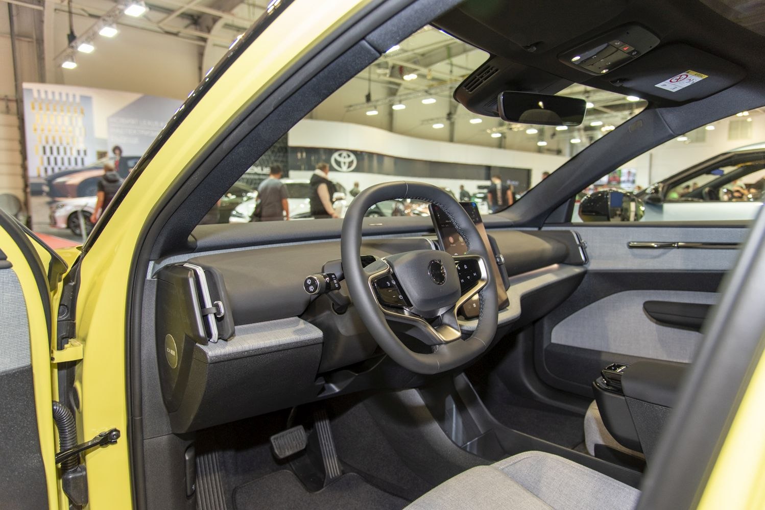 Modern steering wheel and digital dashboard in Volvo EX30 interior