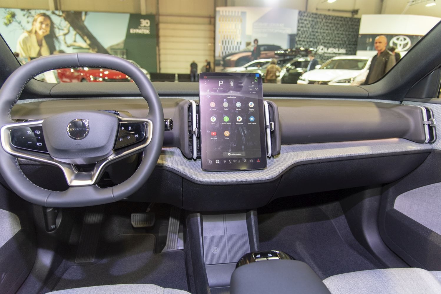 Digital touchscreen and multifunction steering wheel in modern car interior