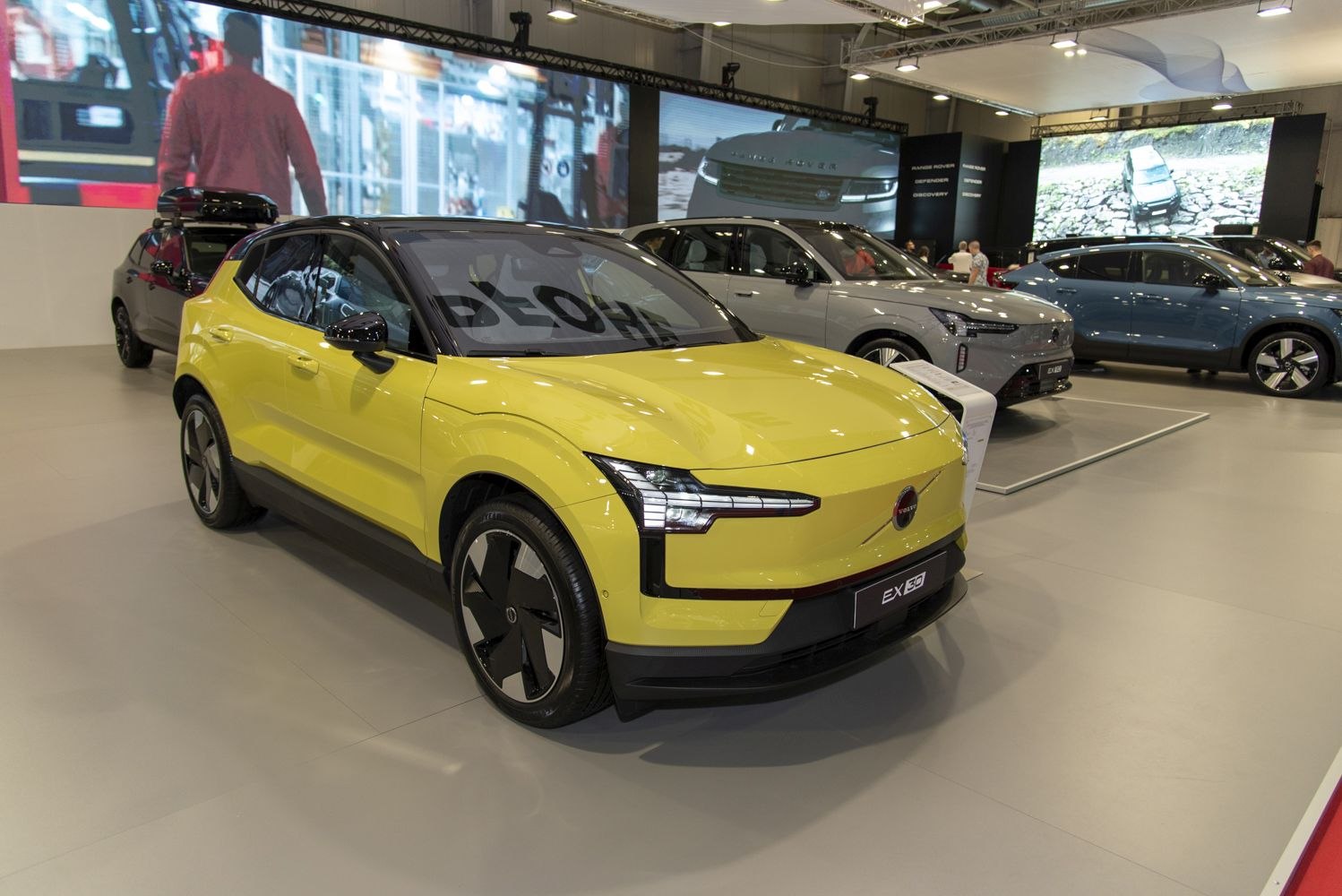Yellow compact electric SUV front three-quarter view with LED headlights