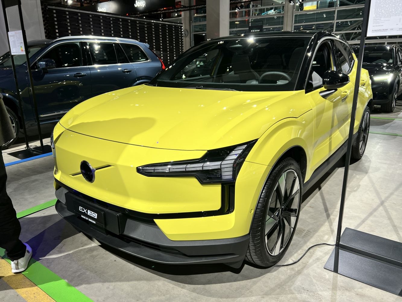 Front and side view of yellow electric SUV with LED headlights and alloy wheels