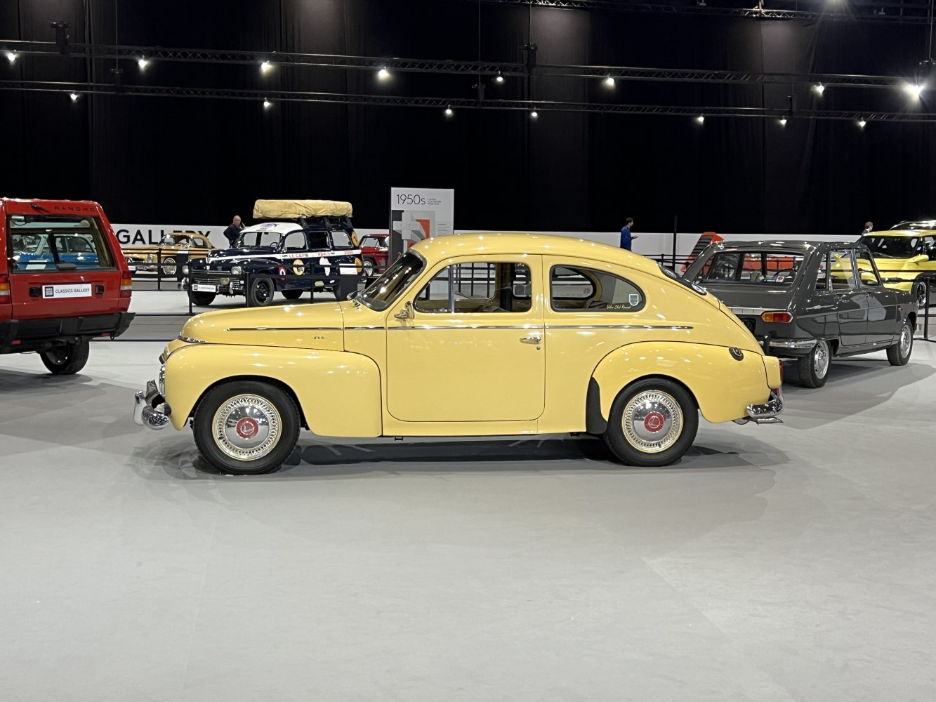 Vintage 1950s sedan with rounded fenders and chrome accents