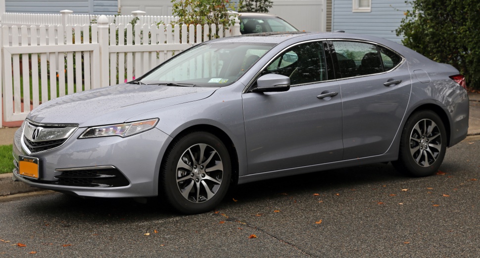 Silver sedan with LED headlights and alloy wheels side angle.