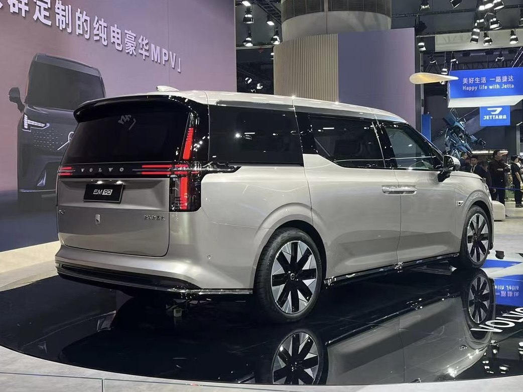 Rear and side view of luxury electric MPV with modern vertical taillights and sleek design