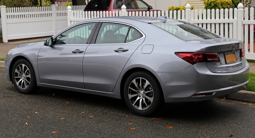 Side and rear view of sedan with alloy wheels and streamlined design