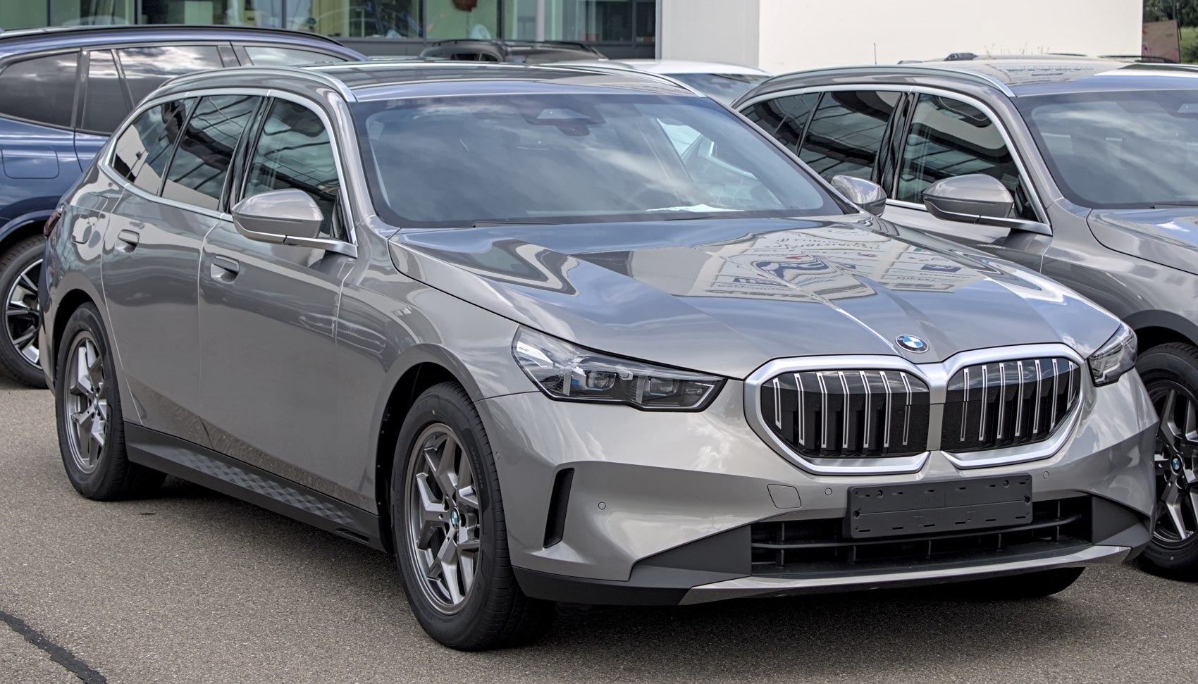Front and side view of a silver modern luxury station wagon