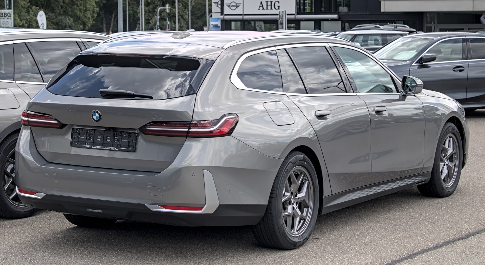 Rear and side view of a modern silver station wagon with sharp taillights