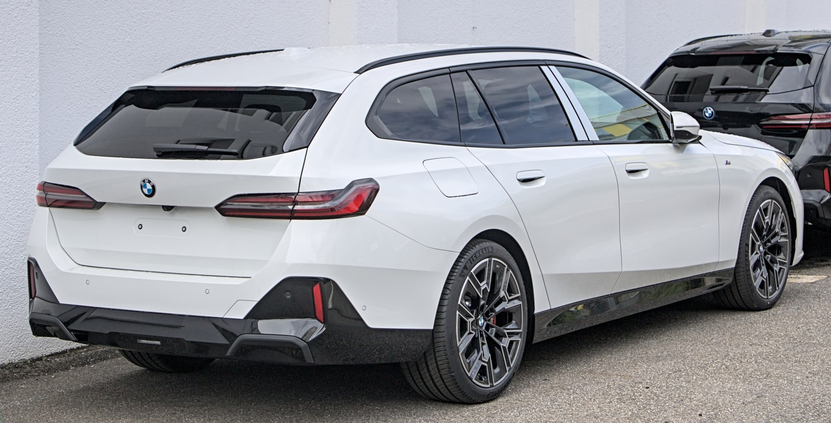 Sleek rear design with LED taillights and multi-spoke alloy wheels
