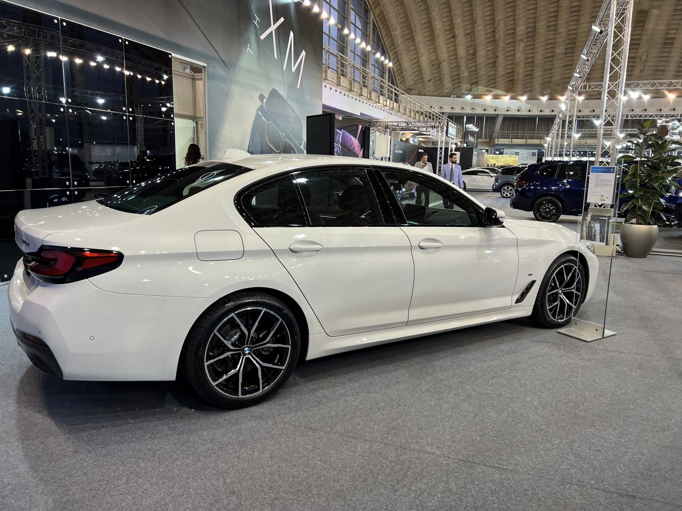 White sedan with modern alloy wheels and sleek side profile